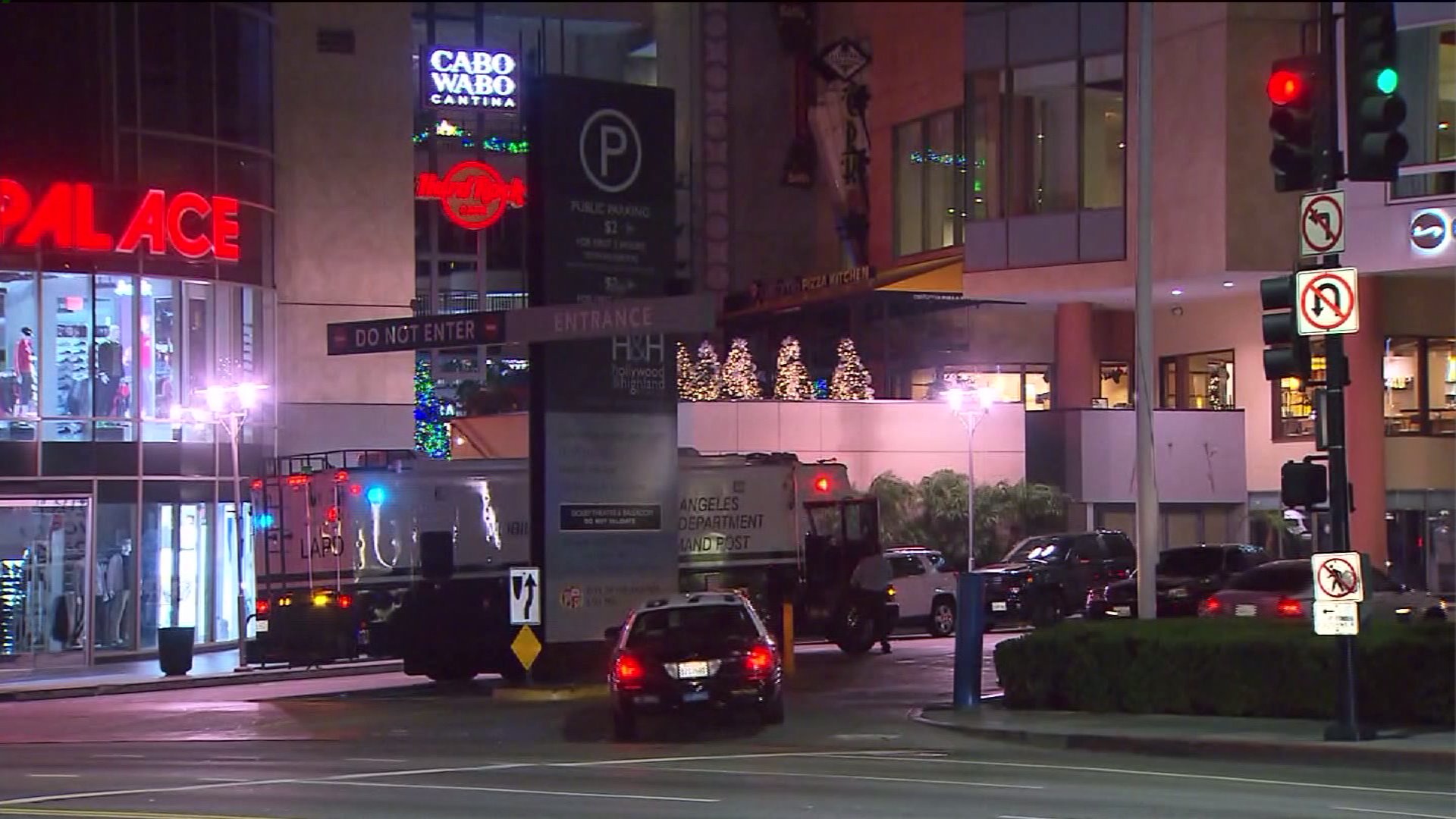 Police gather outside the Hollywood & Highland complex on Friday, Dec. 26, 2014, following an officer-involved shooting.