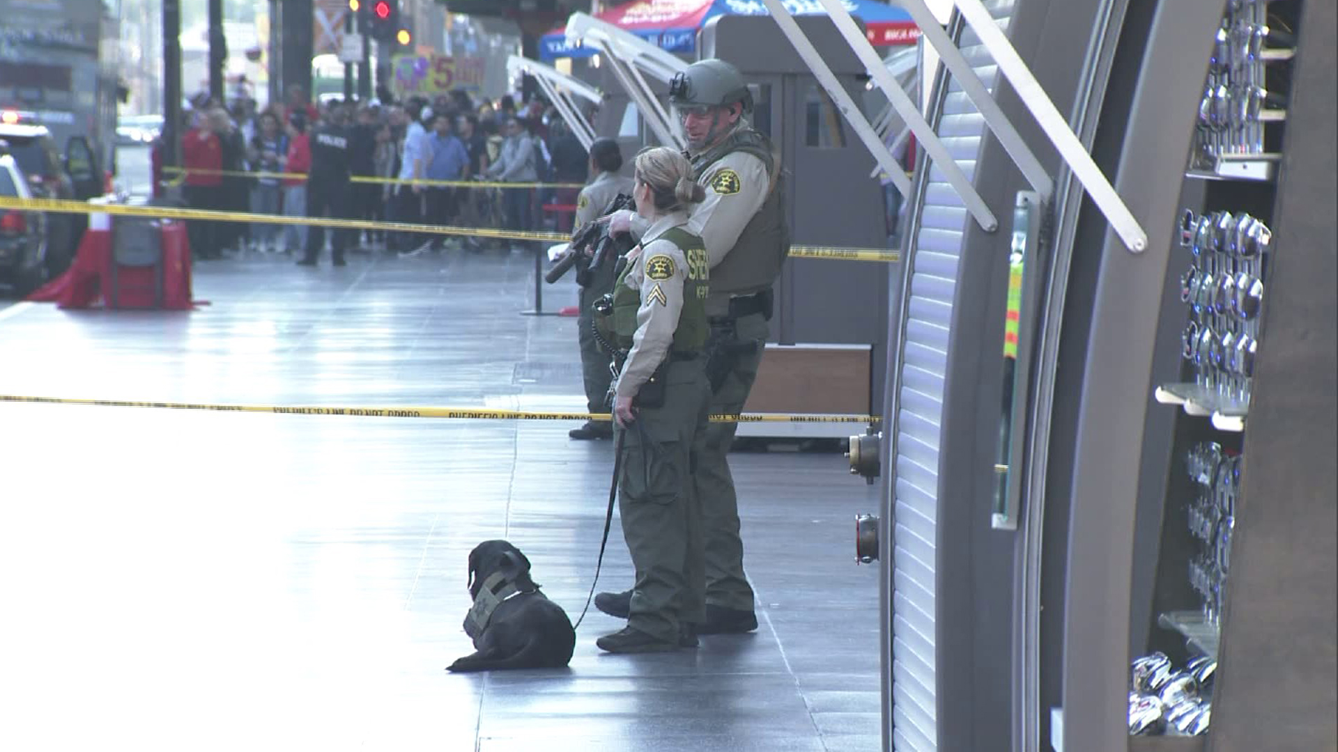 Los Angeles County Sheriff's Department deputies stand in front the Hollywood/Highland Metro station on Jan. 13, 2015. (KTLA)