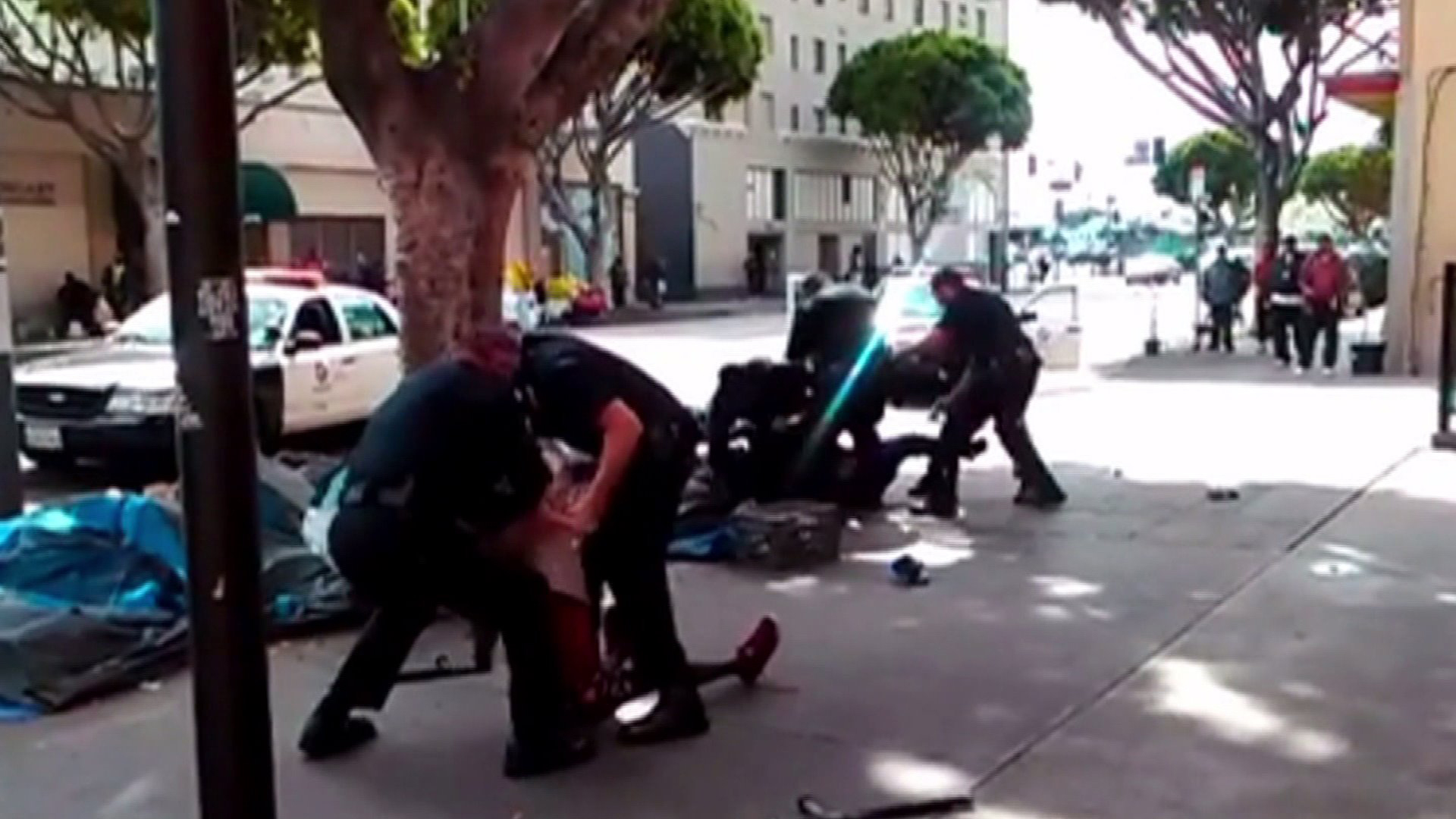 A screenshot from a bystander’s video show Los Angeles police officers struggling with a man moments before he was fatally shot in downtown on Sunday, March 1, 2015. (Credit: Anthony Blackburn/via Facebook)