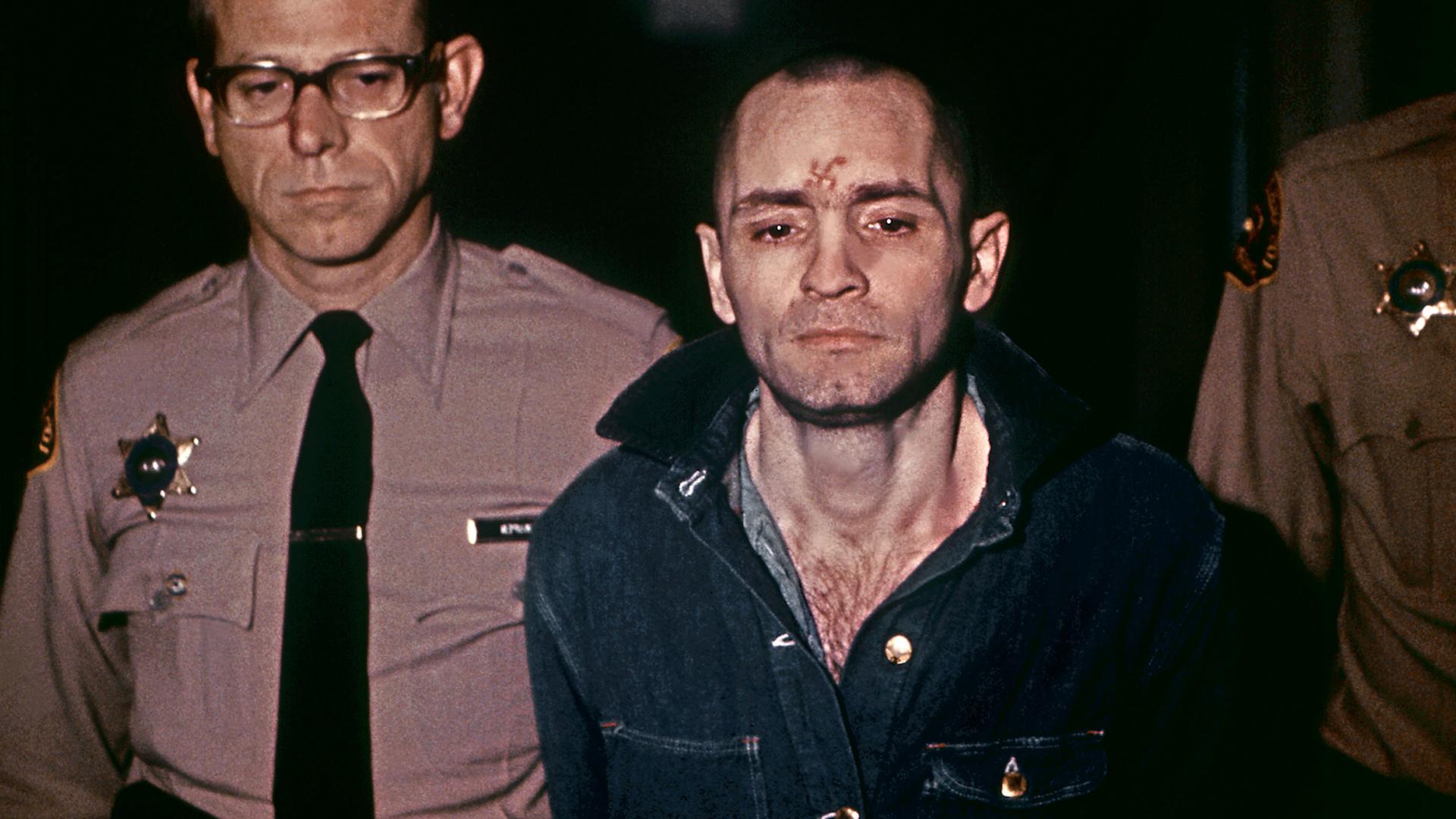 Beardless and shaven-headed, Charles Manson, is sullen faced as he goes to hear sentence of death in the gas chamber passed by the court March 29, 1971, in Los Angeles. Manson was convicted of murder, after in August 1969, during two bloody evenings of paranoid, psychedelic savagery, at least nine people were murdered among them Sharon Tate, the young and pregnant actress and wife of Roman Polanski. The trial of Manson and three girls followers similarly sentenced lasted ten months. (Credit: AFP/Getty Images)