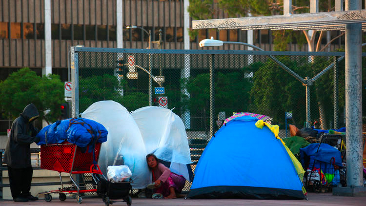 A homeless camp can be seen in the shadow of Los Angeles City Hall on Main Street. (Credit: Irfan Khan/Los Angeles Times)