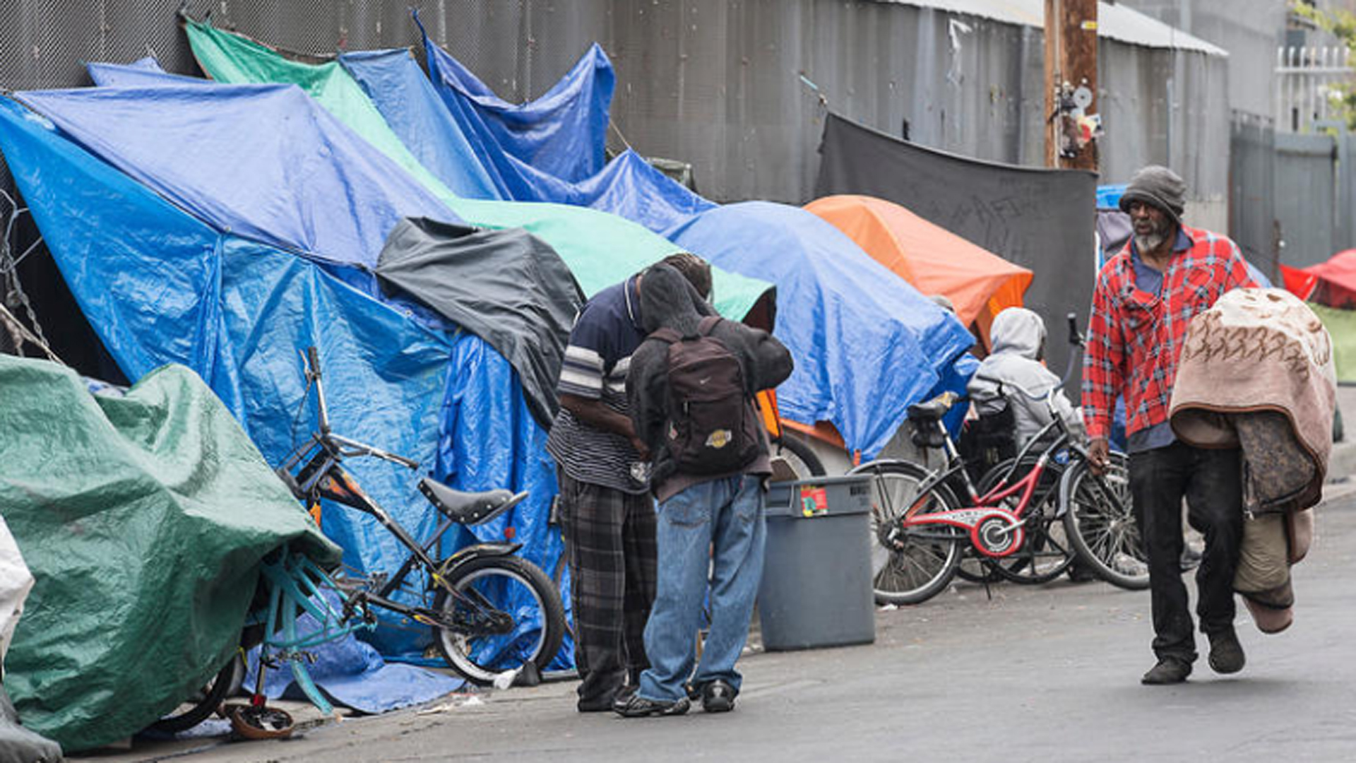 Homeless people set up tarps and tents in downtown Los Angeles' Skid Row in May 2016. (Credit: Brian van der Brug / Los Angeles Times)