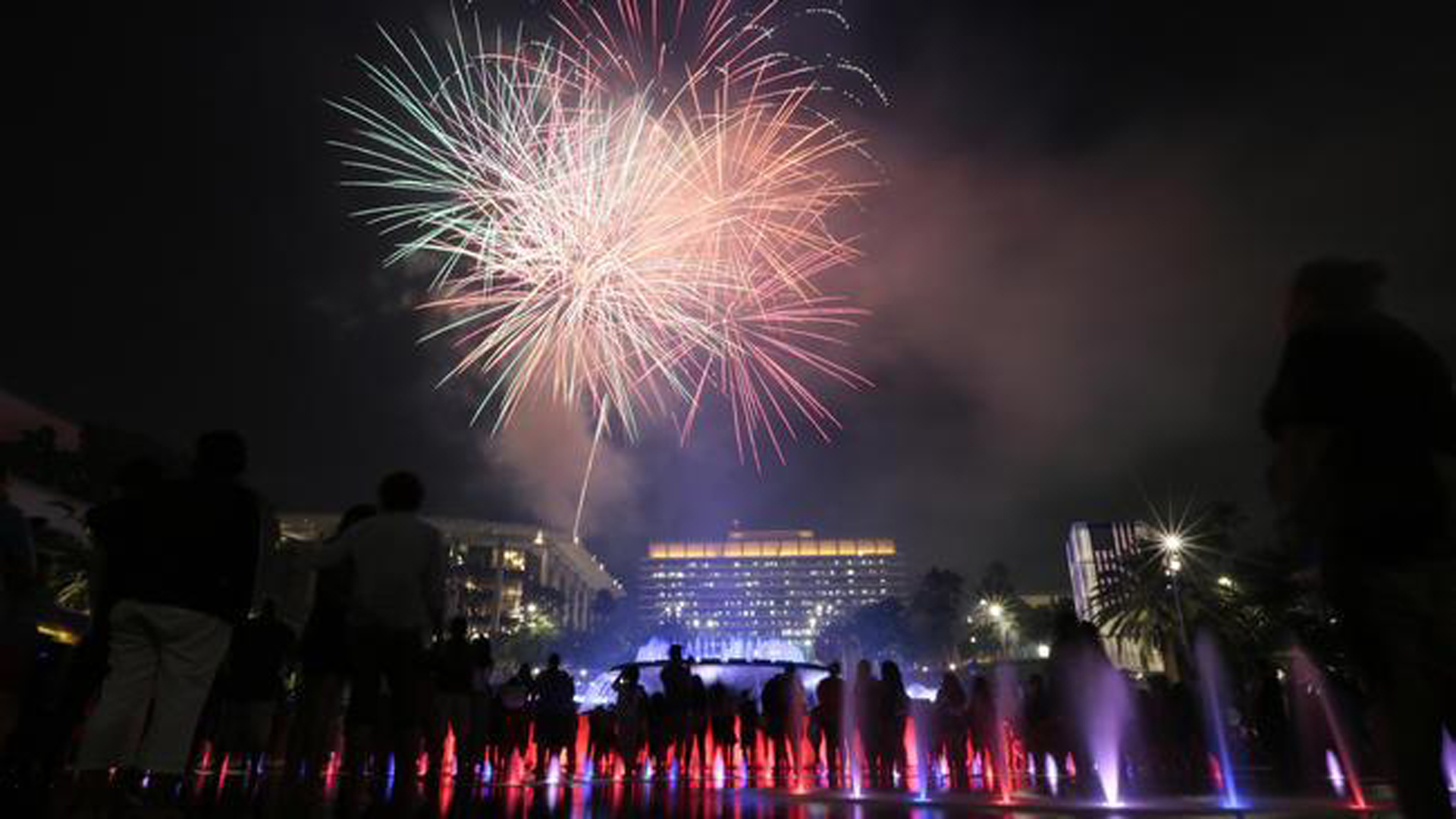 Fireworks explode over the Dorothy Chandler Pavilion as tens of thousands of people look on from the Grand Park Fourth of July celebration in downtown Los Angeles on Friday, July 4, 2014. (Credit: Robert Gauthier/Los Angeles Times)