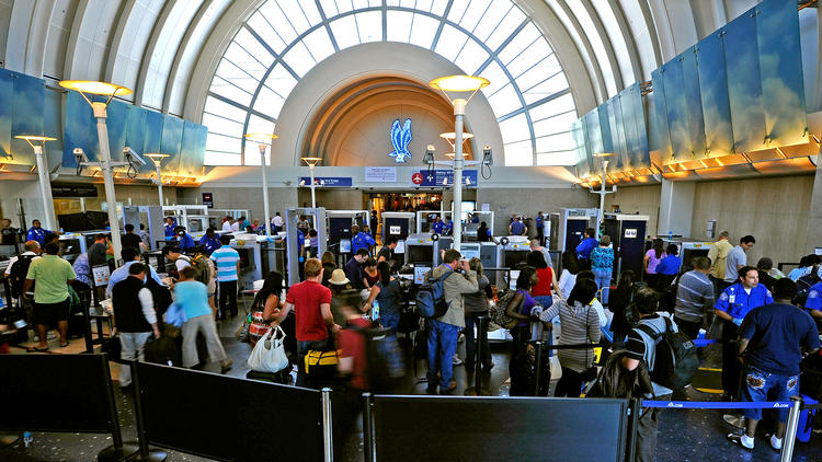 Passengers wait to pass through TSA security at Los Angeles International Airport. (Credit: Kevork Djansezian / Getty Images)