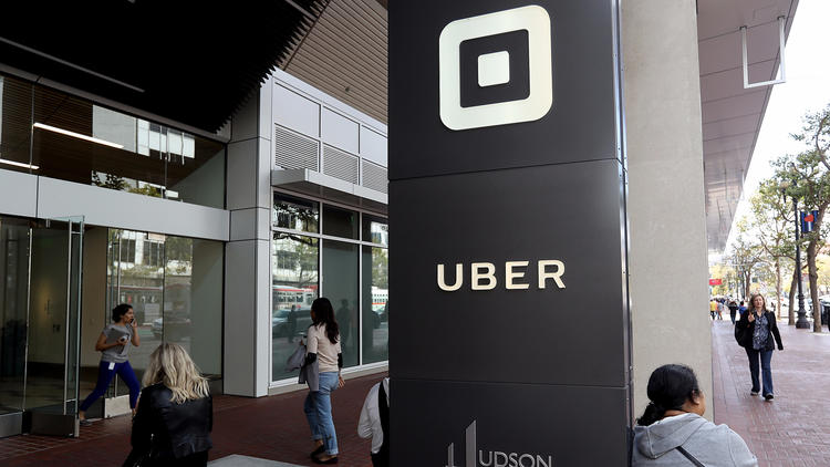 The logo of the ride-sharing service Uber in front of its headquarters in San Francisco. (Credit: Justin Sullivan / Getty Images)