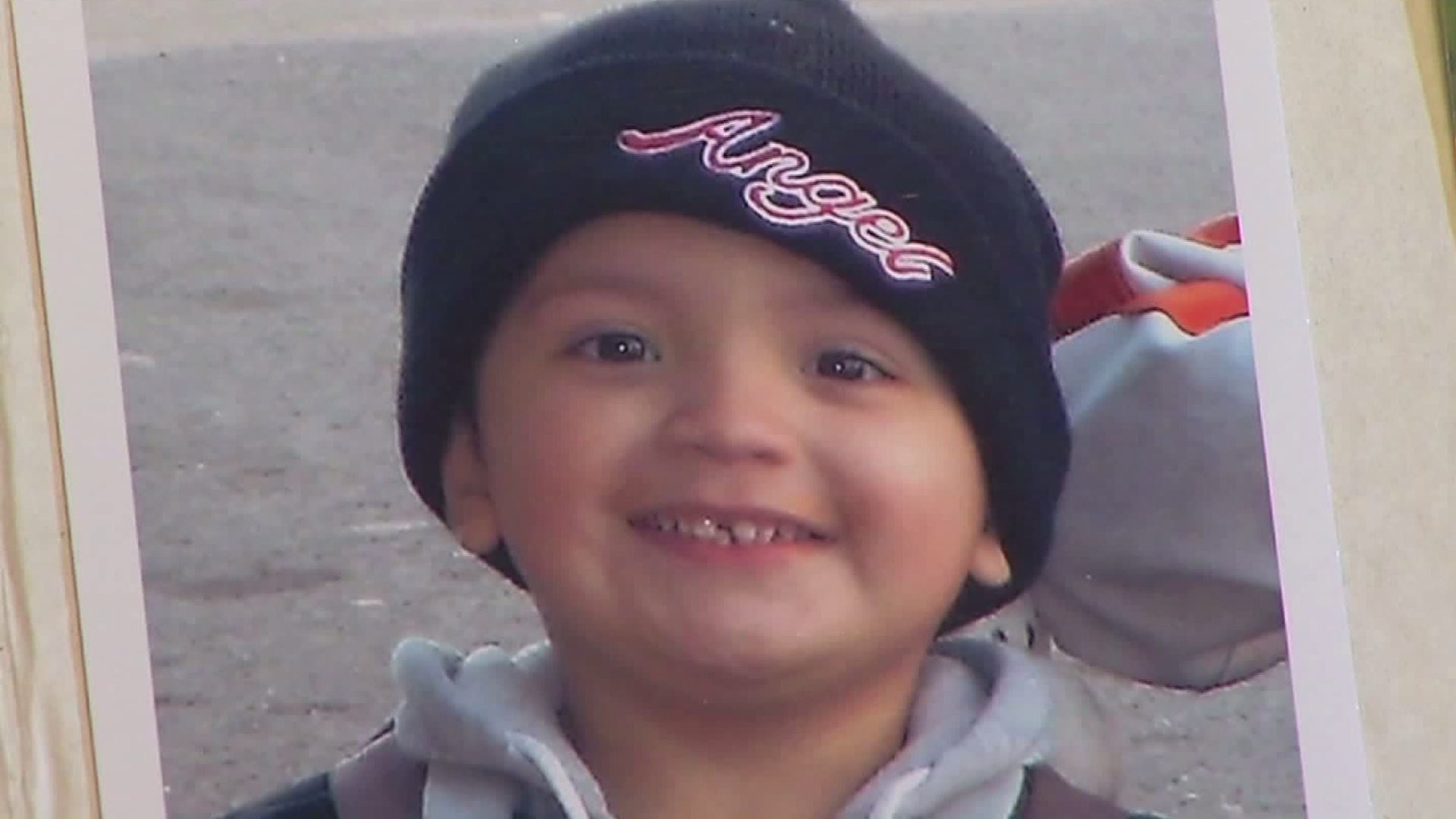 Yonatan Daniel Aguilar is seen in a family photo album shown at his public memorial on Sept. 14, 2016 in Echo Park. (Credit: KTLA)