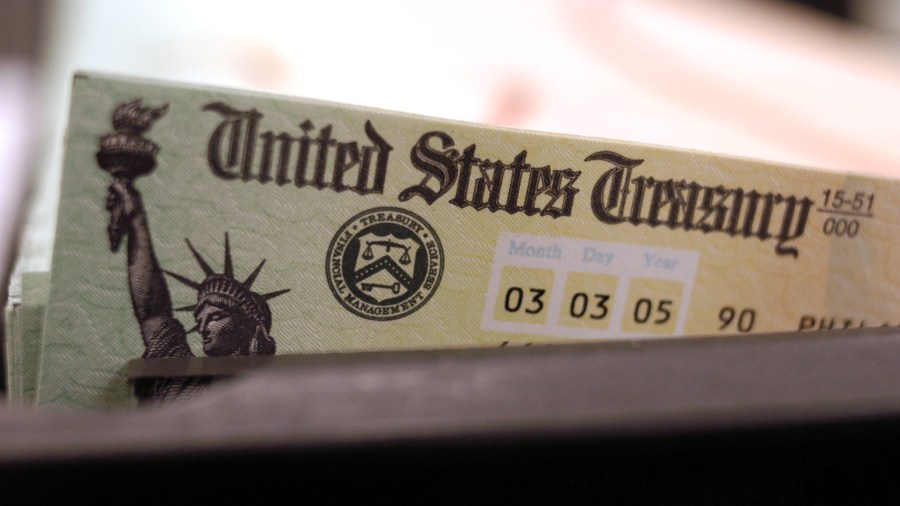 Blank Social Security checks are run through a printer at the U.S. Treasury printing facility February 11, 2005 in Philadelphia, Pennsylvania. (Credit: William Thomas Cain/Getty Images)