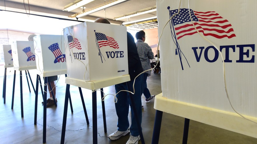 In this file image, voters cast their ballots at a polling station in Alhambra on Nov. 4, 2014. (Credit: FREDERIC J. BROWN/AFP/Getty Images)