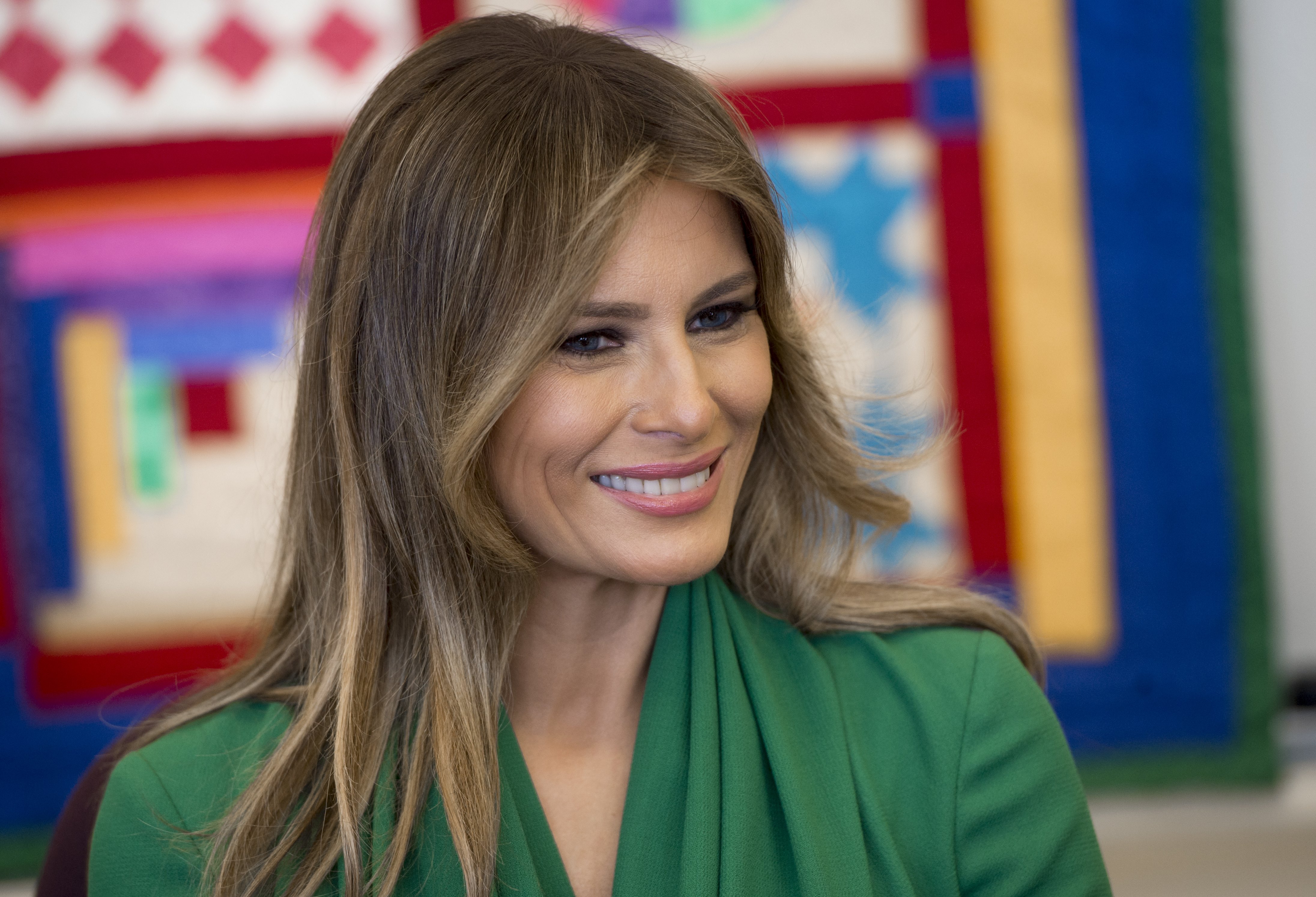 U.S. First Lady Melania Trump talks with students during a visit with Jordan's Queen Rania to the Excel Academy Public Charter School in Washington, D.C, April 5, 2017. (Credit: SAUL LOEB/AFP/Getty Images)