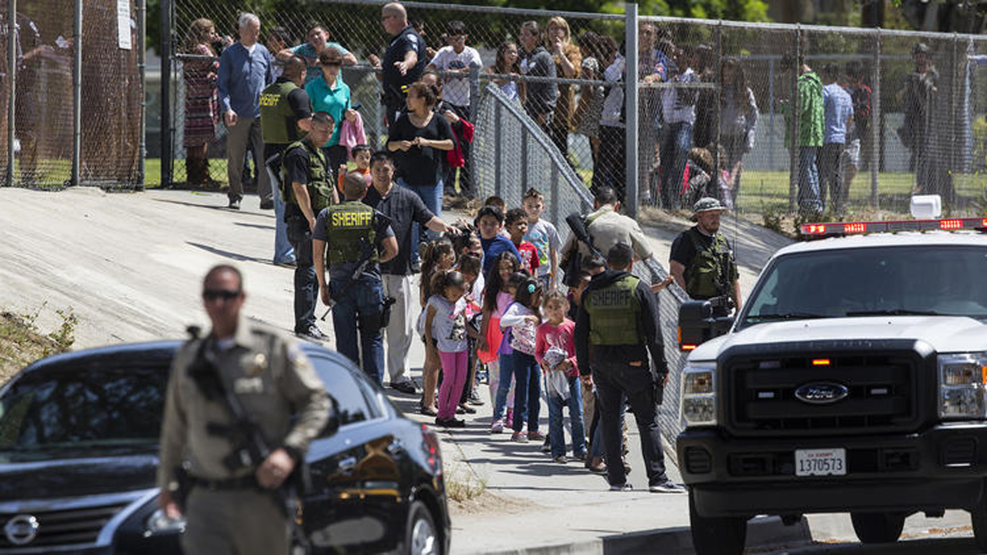 Students leave North Park Elementary School in San Bernardino amid a heavy police presence following a shooting on April 10, 2017. (Credit: Gina Ferazzi/Los Angeles Times)