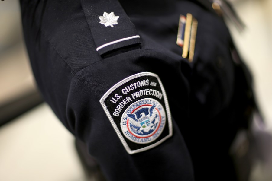 A U.S. Customs and Border Protection officer's patch is seen as they unveil a new mobile app for international travelers arriving at Miami International Airport on March 4, 2015. (Credit: Joe Raedle / Getty Images)