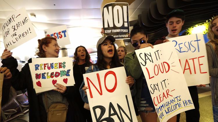 Demonstrators gather at Tom Bradley International Terminal at LAX in late January 2017 to protest President Trump's travel ban. (Genaro Molina / Los Angeles Times)