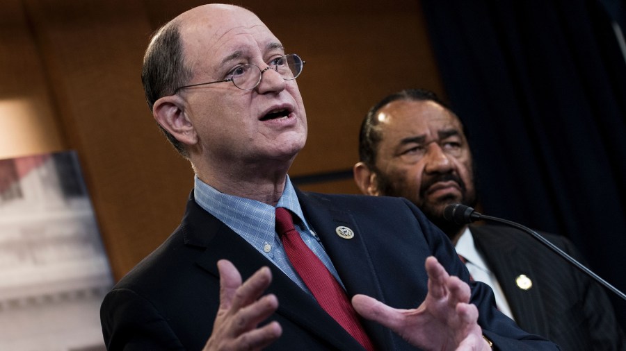 U.S. Representative Brad Sherman, left, Democrat of California, and U.S. Representative Al Green, Democrat of Texas, take questions about articles of impeachment for U.S. President Donald Trump during a press conference on Capitol Hill June 7, 2017. (Credit: Brendan Smialowski / AFP / Getty Images)