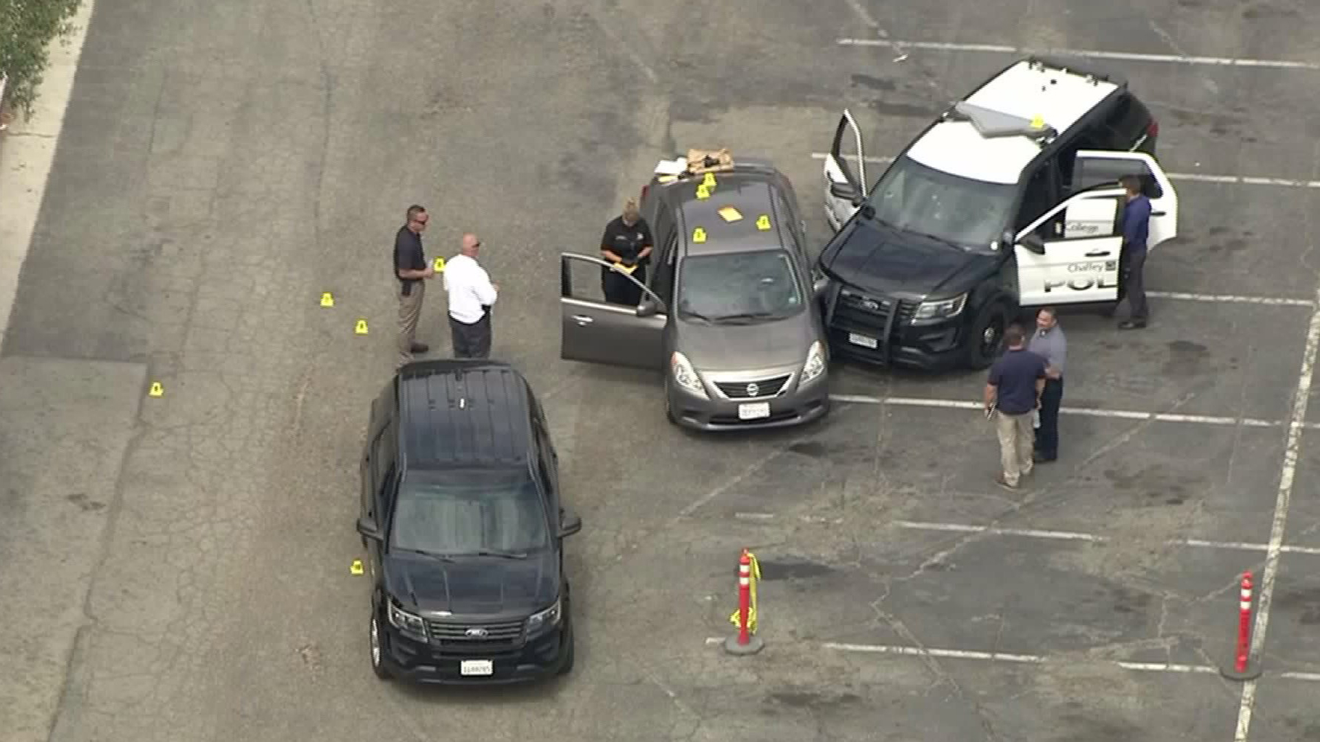 Evidence markers are seen on a car at Chaffey College on July 25, 2017. (Credit: KTLA)