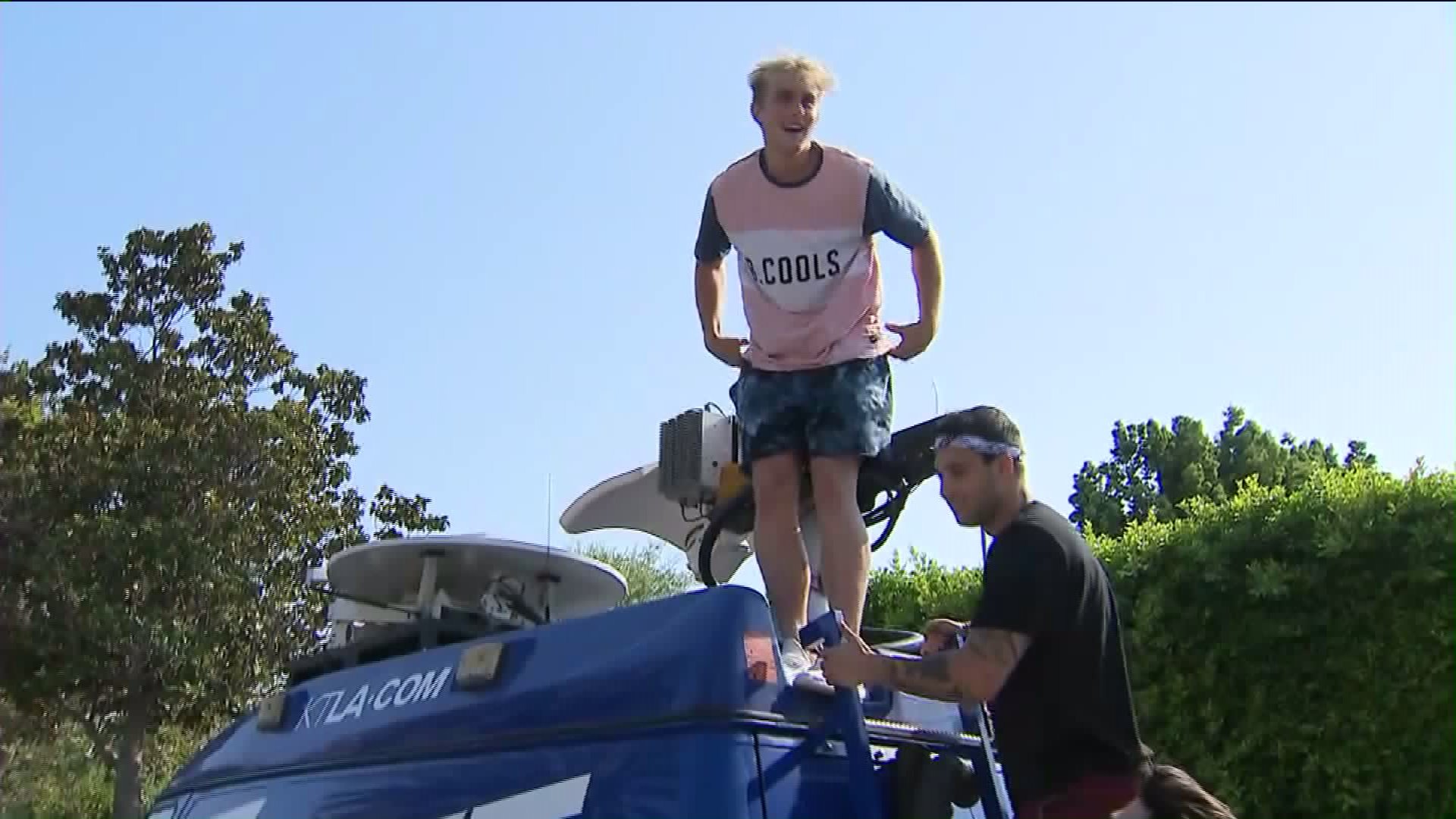 Jake Paul jumps on top of a KTLA 5 News van as Chris Wolfe reports on July 17, 2017.(Credit: KTLA)