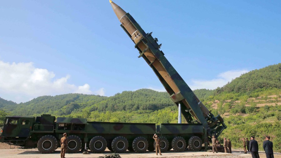 This picture taken and released on July 4, 2017, by North Korea's official Korean Central News Agency (KCNA) shows North Korean leader Kim Jong-Un, second from right, inspecting the test-fire of the intercontinental ballistic missile Hwasong-14 at an undisclosed location. (Credit:  AFP PHOTO / KCNA VIA KNS / STR / South Korea)