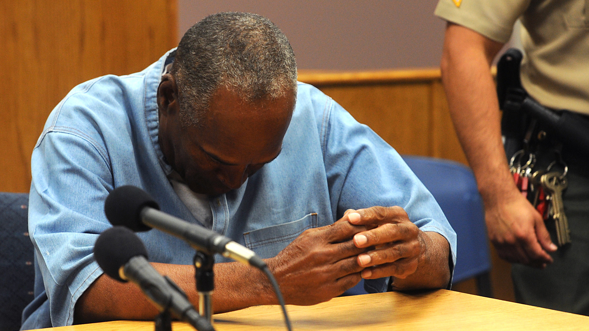 O.J. Simpson reacts after learning he was granted parole at Lovelock Correctional Center July 20, 2017 in Lovelock, Nevada. . (Credit: Jason Bean-Pool/Getty Images)