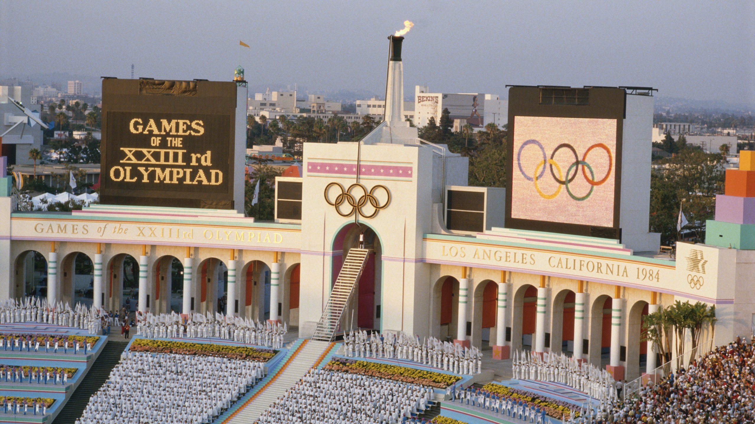 An overview of the opening ceremony at the Los Angeles Coliseum during the lighting of the Olympic flame of the 1984 Summer Olympics. (Credit: Getty Images)