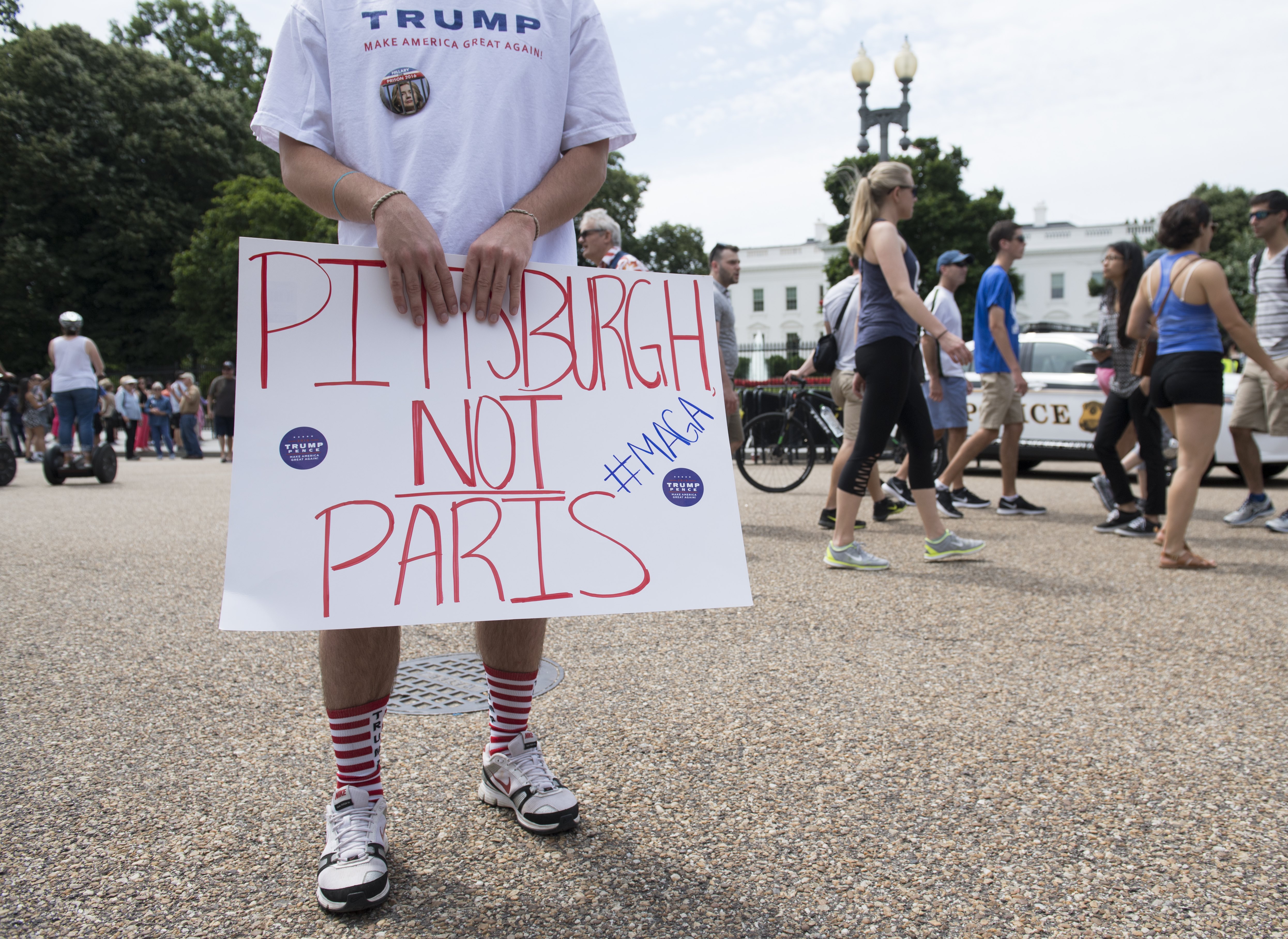 Supporters of U.S. President Donald Trump and his policies demonstrate during a "Pittsburgh Not Paris" rally in support of his decision to withdraw the U.S. from the Paris Agreement next to the White House in Washington, DC, on June 3, 2017. (Credit: Saul Loeb / AFP / Getty Images)