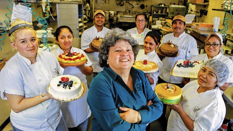 Betty Porto, center, is one of three siblings who run Porto's Bakery & Cafe, the family business founded by their Cuban emigre parents. (Credit: Irfan Khan / Los Angeles Times)