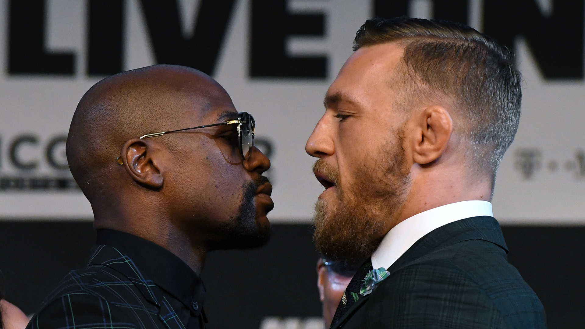 Boxer Floyd Mayweather Jr., left, and UFC lightweight champion Conor McGregor, right, face off during a news conference at the KA Theatre at MGM Grand Hotel & Casino on August 23, 2017 in Las Vegas. (Credit: Ethan Miller/Getty Images)