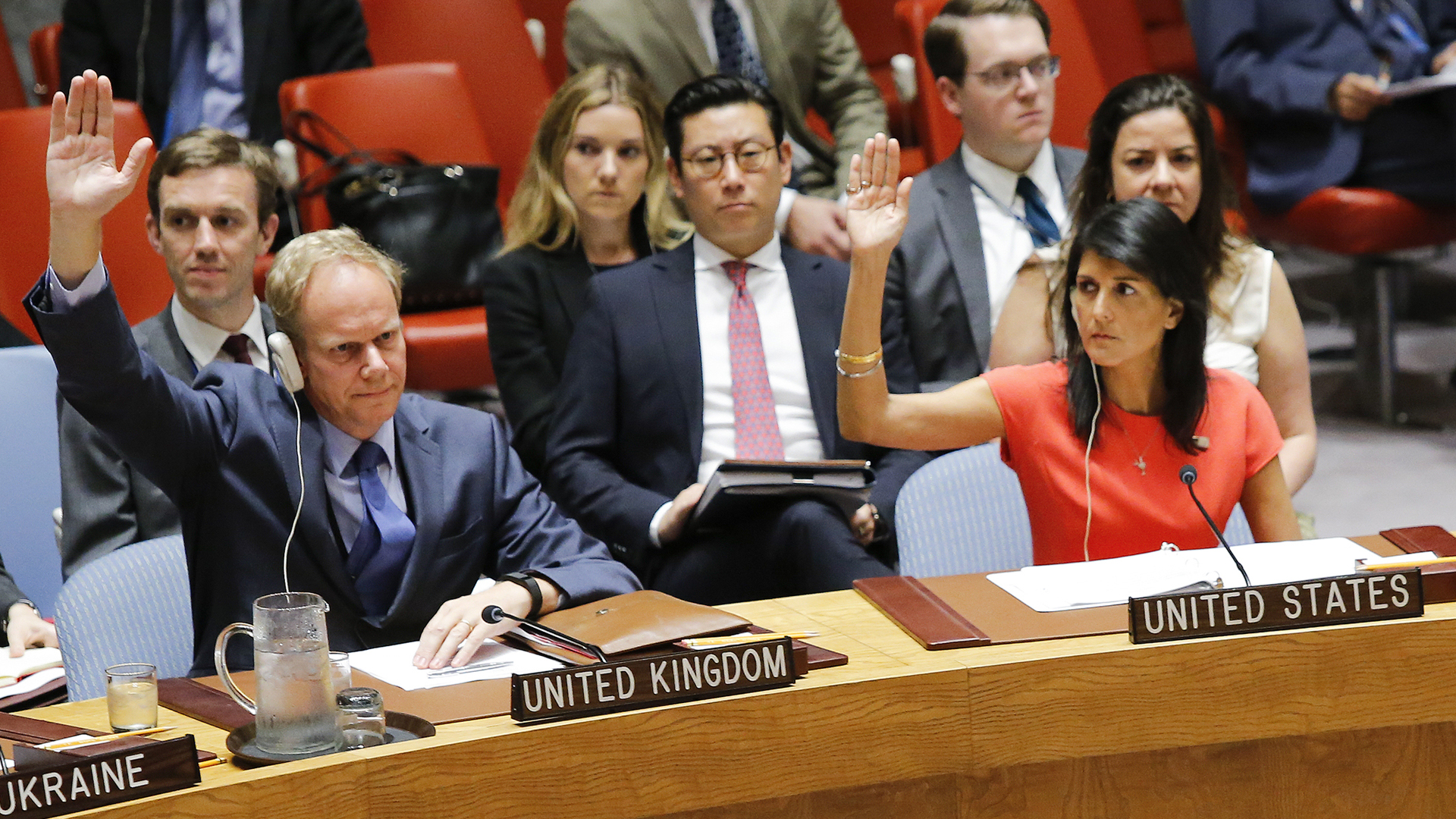 U.S. Ambassador to the United Nations Nikki Haley and Britain's Ambassador Matthew Rycroft vote on a U.S.-drafted resolution toughening sanctions on North Korea, at the United Nations Headquarters in New York City on August 5, 2017. (Credit: Eduardo Munoz Alvarez/AFP/Getty Images)