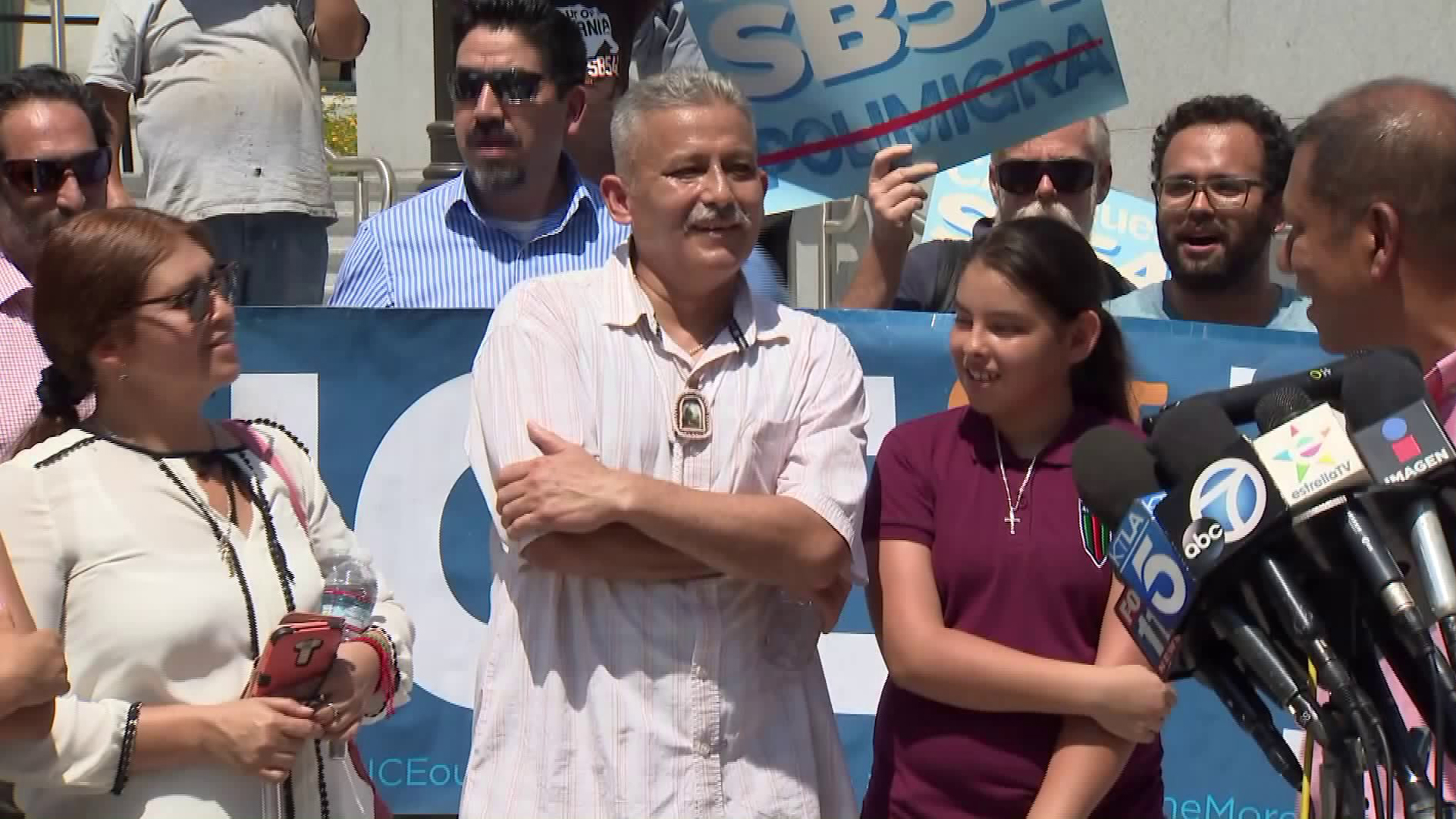 Romulo Avelica-Gonzalez, center, appears outside the Los Angeles County Sheriff's Department headquarters on Aug. 31, 2017, the day after he was released from the custody of U.S. Immigration and Customs Enforcement. (Credit: KTLA)