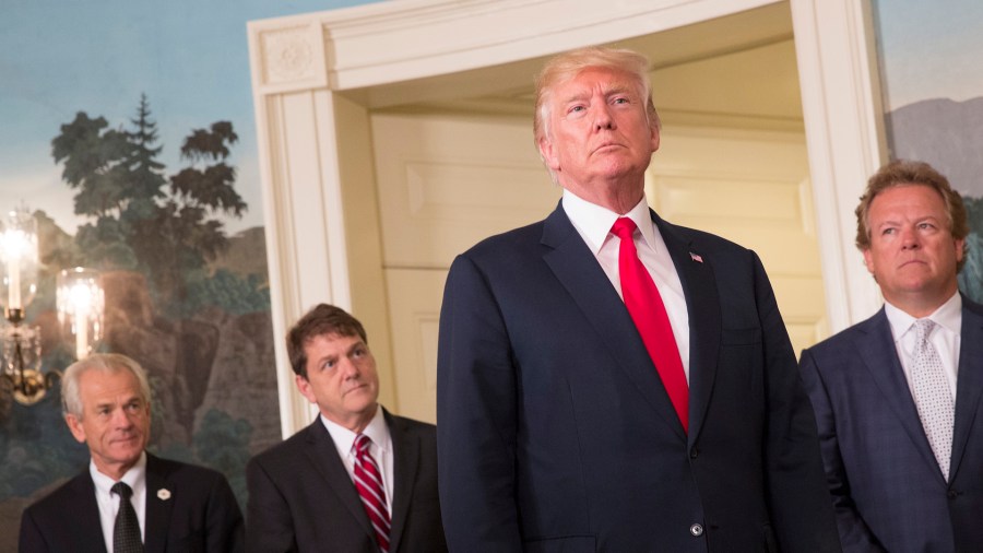 President Donald Trump appears alongside advisers in the White House on August 14, 2017.(Credit: Chris Kleponis-Pool/Getty Images)