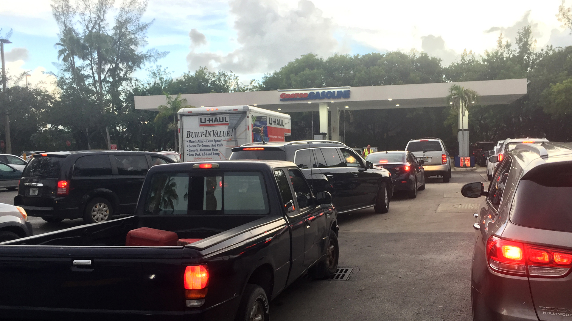 Cars wait in line at a gas station in North Miami as people shop ahead of Hurricane Irma, on Sept. 5, 2017. (Credit: Michelle Eve Sandberg/AFP/Getty Images)