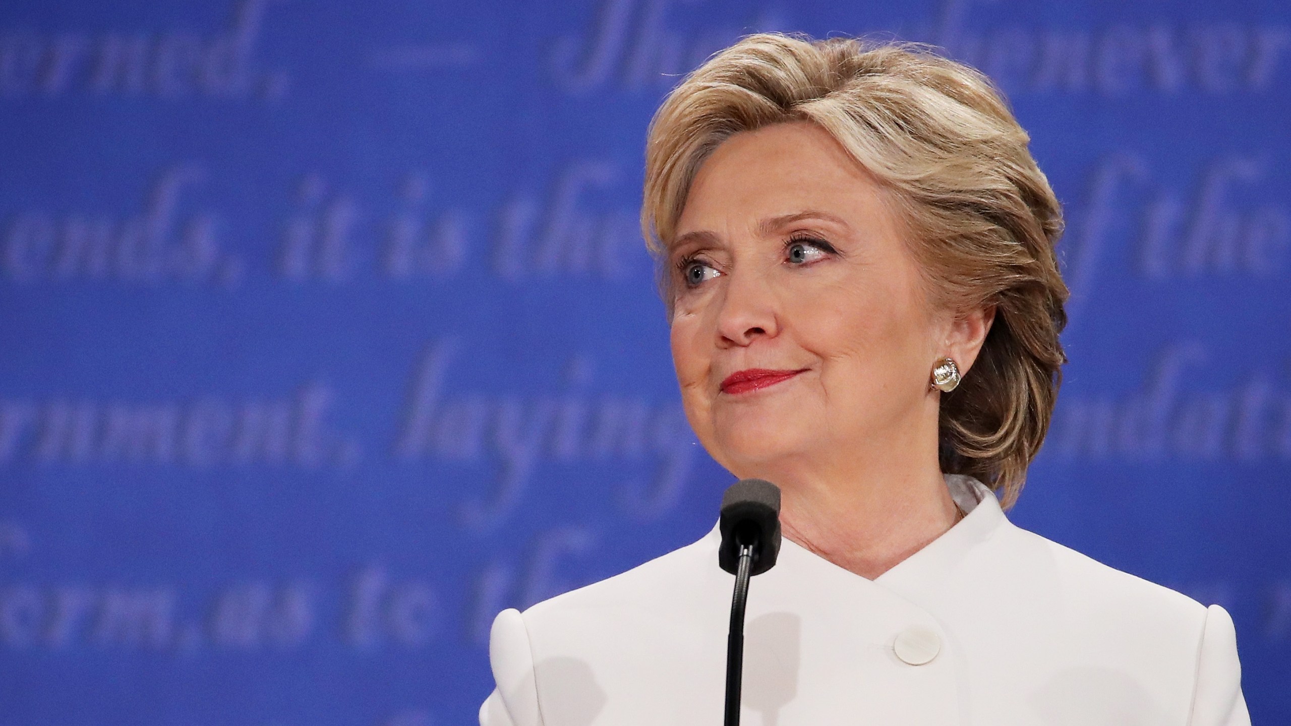 Democratic presidential nominee former Secretary of State Hillary Clinton listens to Republican presidential nominee Donald Trump speak during the third U.S. presidential debate at the Thomas & Mack Center on Oct. 19, 2016, in Las Vegas, Nevada. (Credit: Drew Angerer / Getty Images)