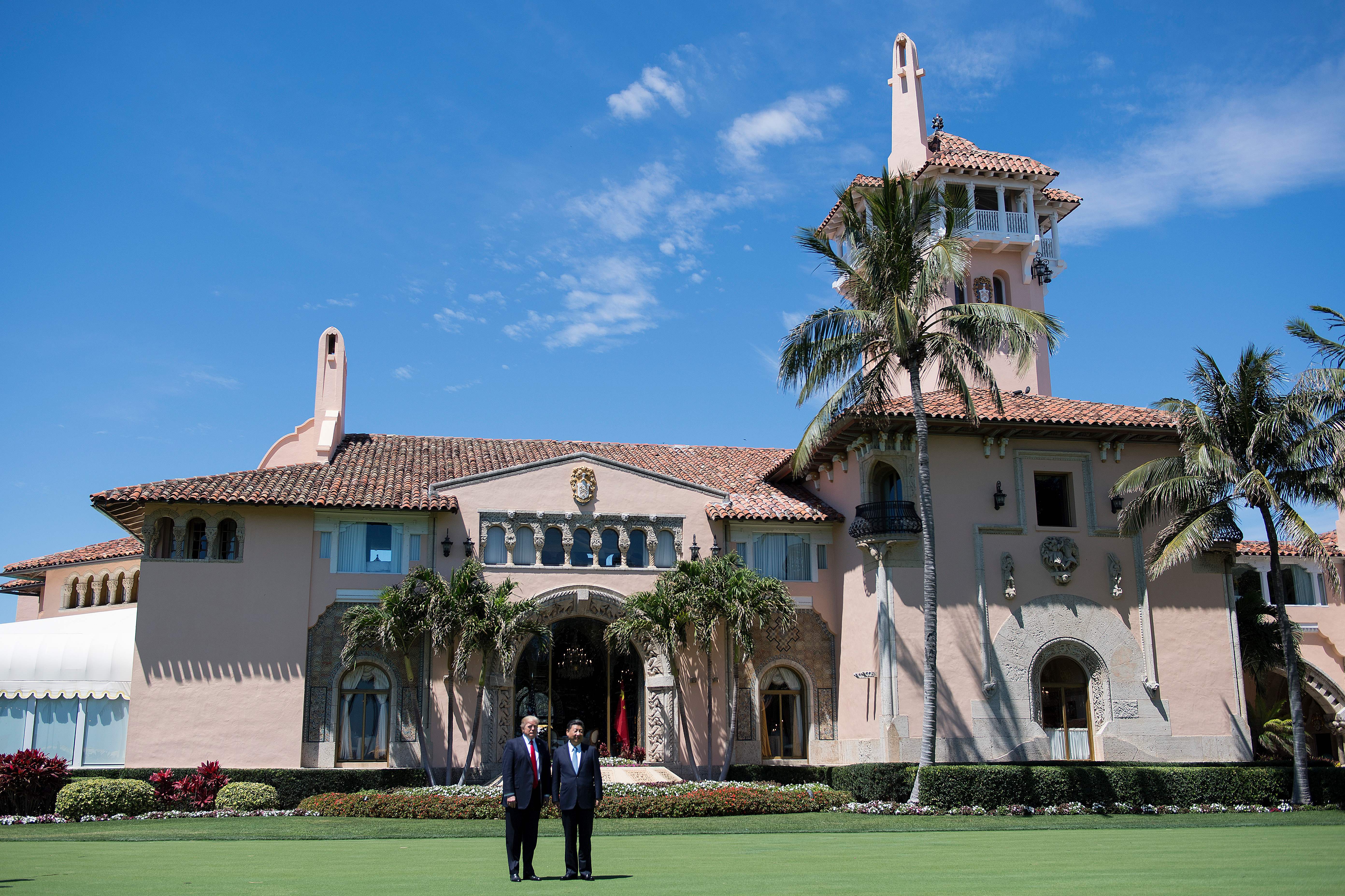 President Donald Trump and Chinese President Xi Jinping pose together at the Mar-a-Lago estate in West Palm Beach, Florida, April 7, 2017. (Credit: JIM WATSON/AFP/Getty Images)