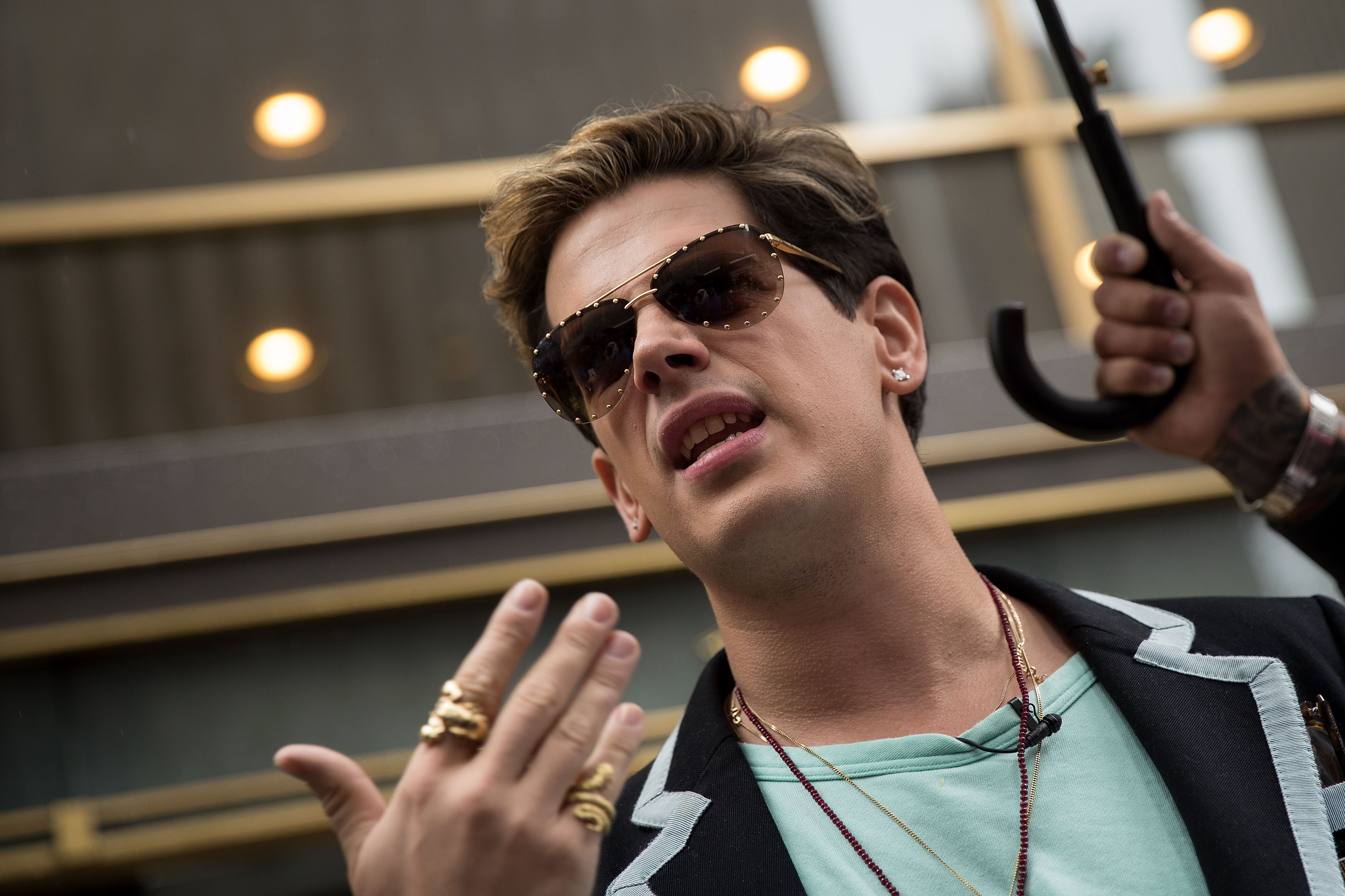 Milo Yiannopoulos speaks outside the offices of Simon & Schuster publishing company, July 7, 2017 in New York City after filing a $10 million legal complaint against the publisher following its decision to cancel his book deal. (Credit: Drew Angerer/Getty Images)