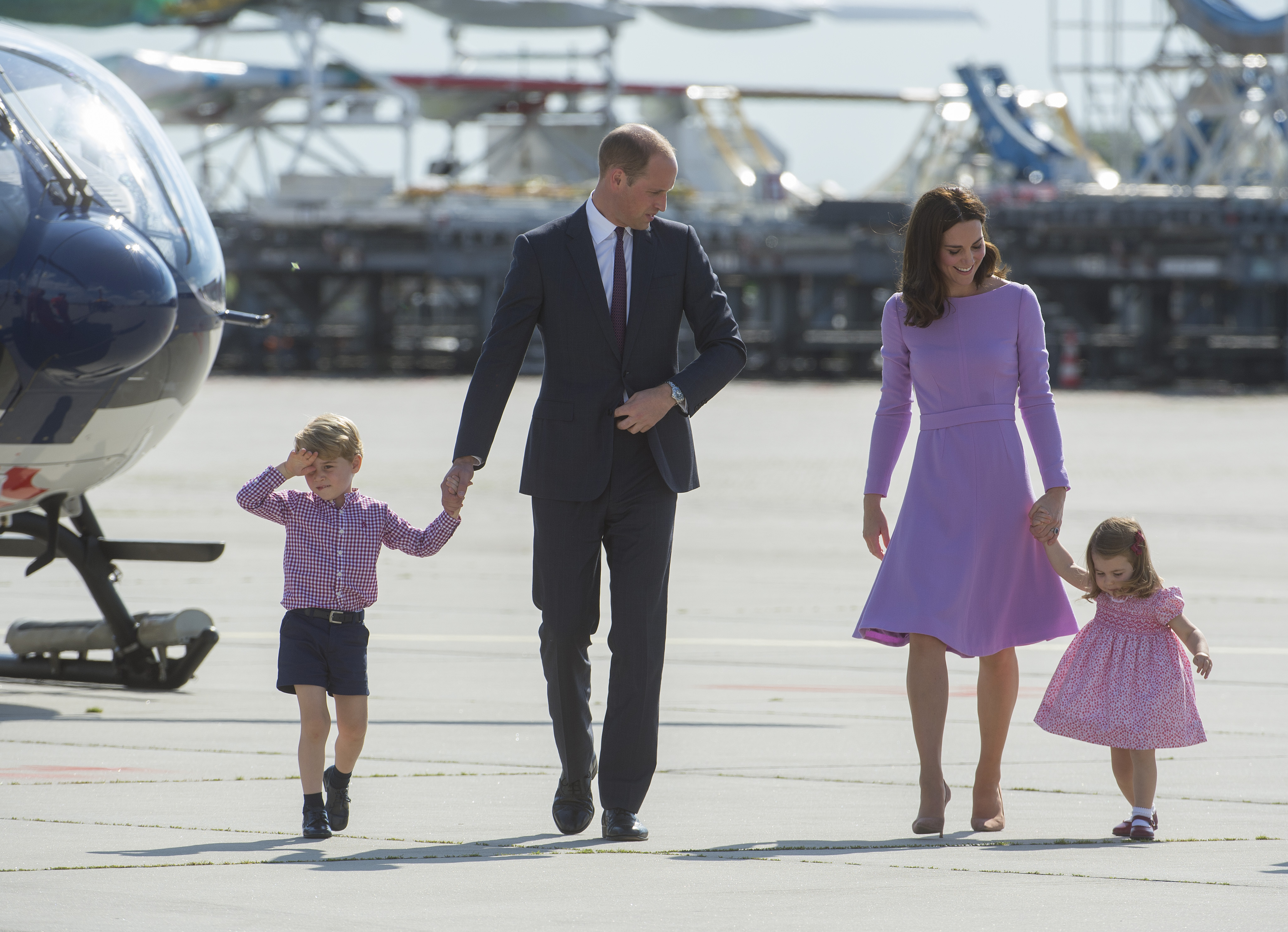 Prince William, Duke of Cambridge, Prince George of Cambridge, Princess Charlotte of Cambridge and Catherine, Duchess of Cambridge depart from Hamburg airport on the last day of their official visit to Poland and Germany on July 21, 2017. (Credit: Julian Simmonds - Pool/Getty Images)