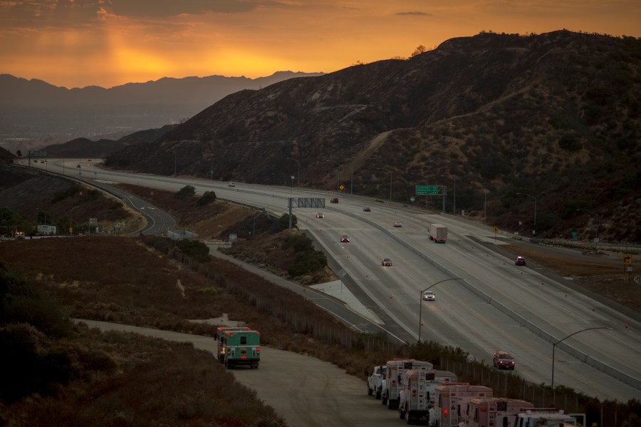 Traffic on the 210 freeway is allowed to resume for the first time since the start of the La Tuna Fire, as light rain showers pass over the burn areas on Sept. 3, 2017. (David McNew / Getty Images)