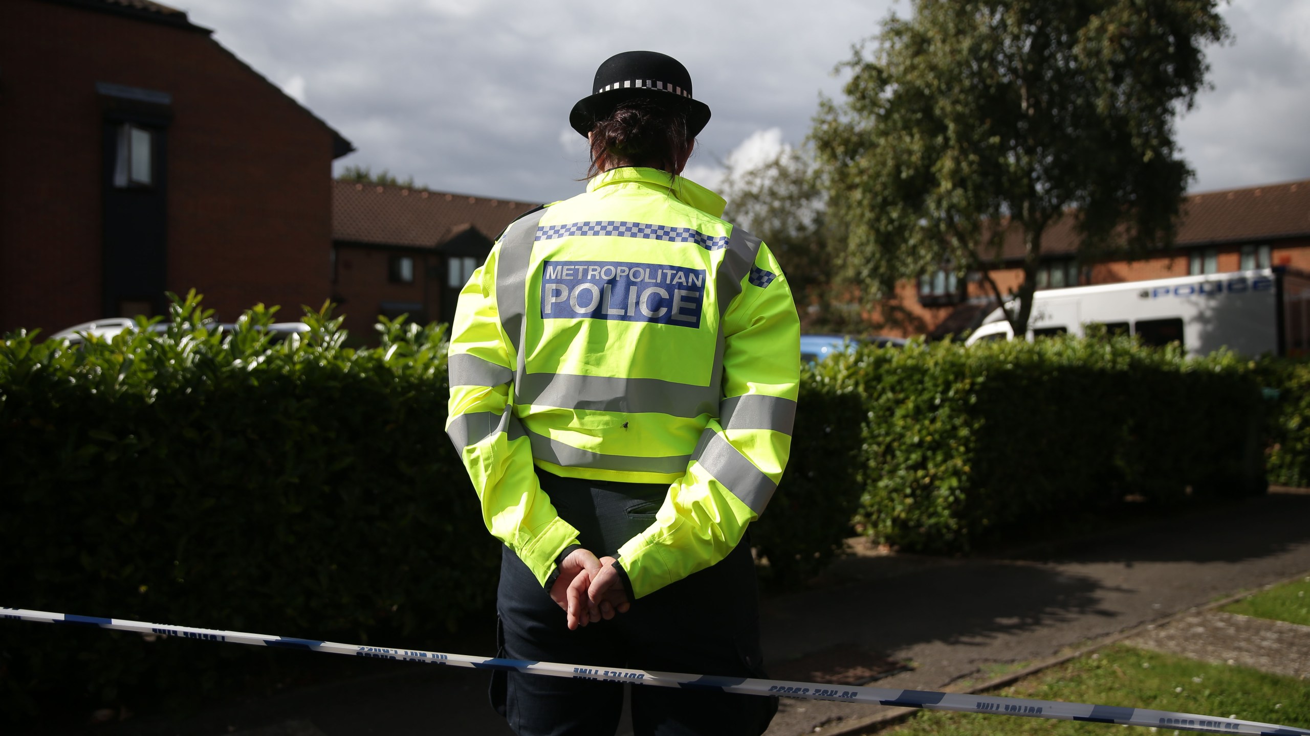 Police stand guard during a search by a police forensics team in Stanwell, Surrey, near London on Sept. 17, 2017. (Credit: Daniel Leal-Olivas / AFP / Getty Images)