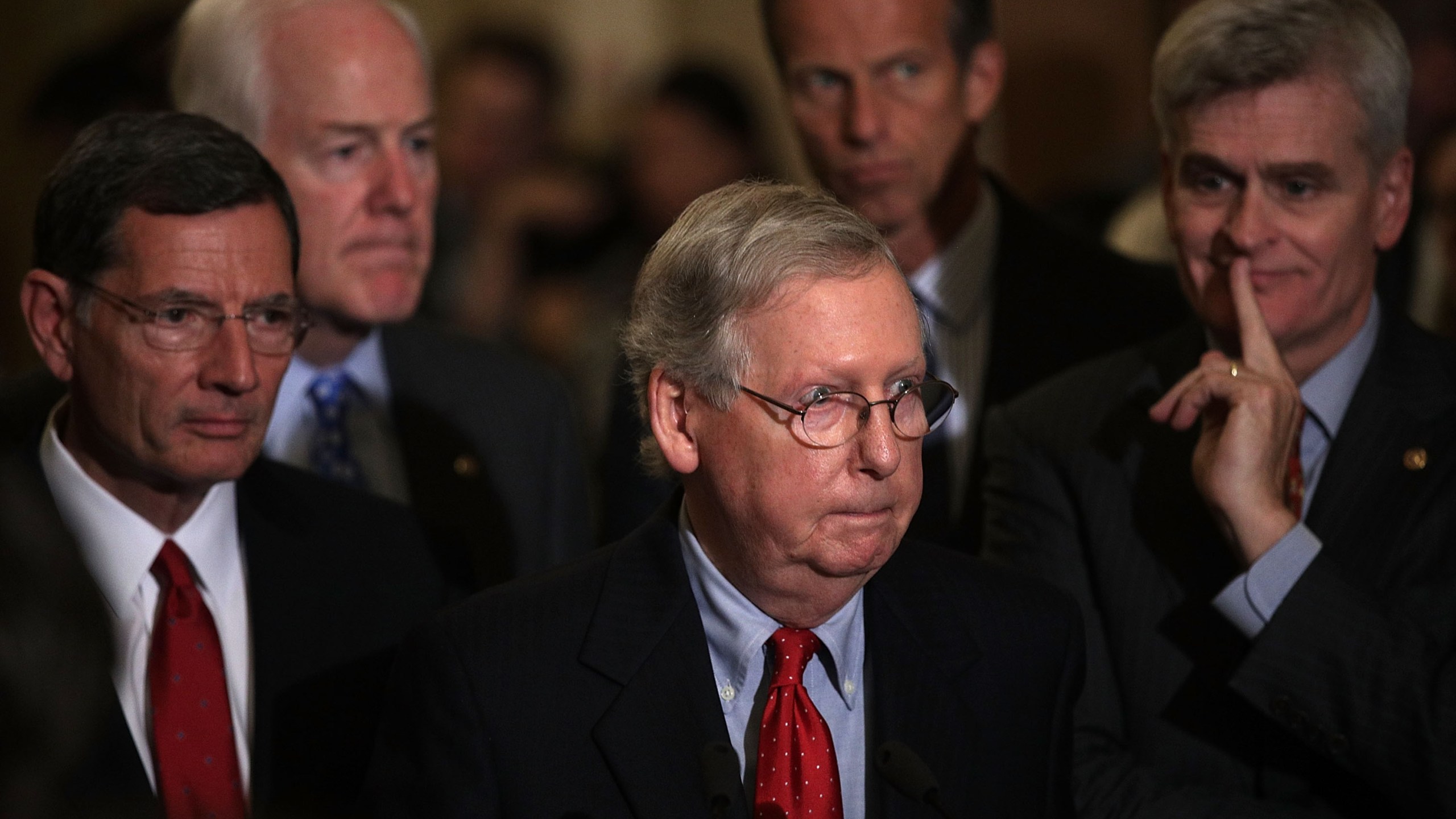 U.S. Senate Majority Leader Sen. Mitch McConnell, center, speaks as Sen. John Barrasso, Senate Majority Whip John Cornyn, Sen. John Thune and Sen. Bill Cassidy listen during a news briefing at the Capitol Sept. 19, 2017. (Credit: Alex Wong/Getty Images)