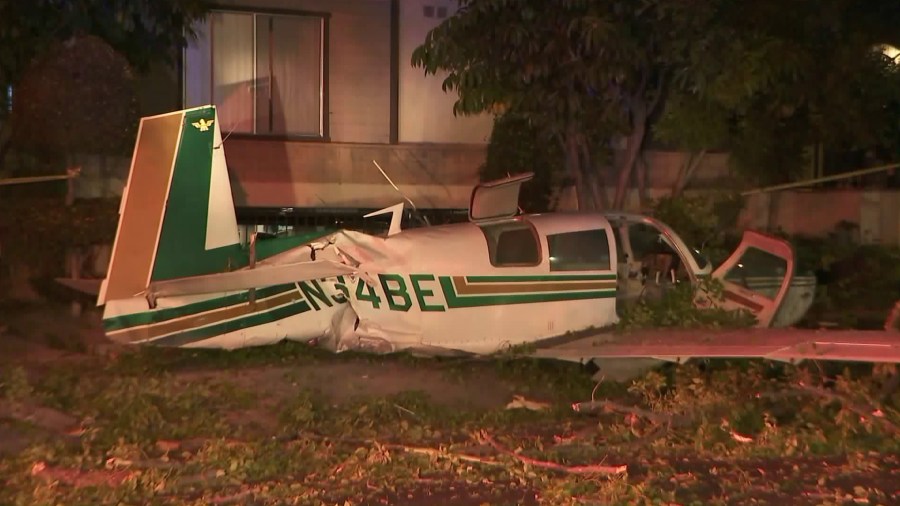 A small plane crash landed in a residential area of Glendale on Sept. 22, 2017. Its two occupants sustained only minor injuries. (Credit: KTLA)