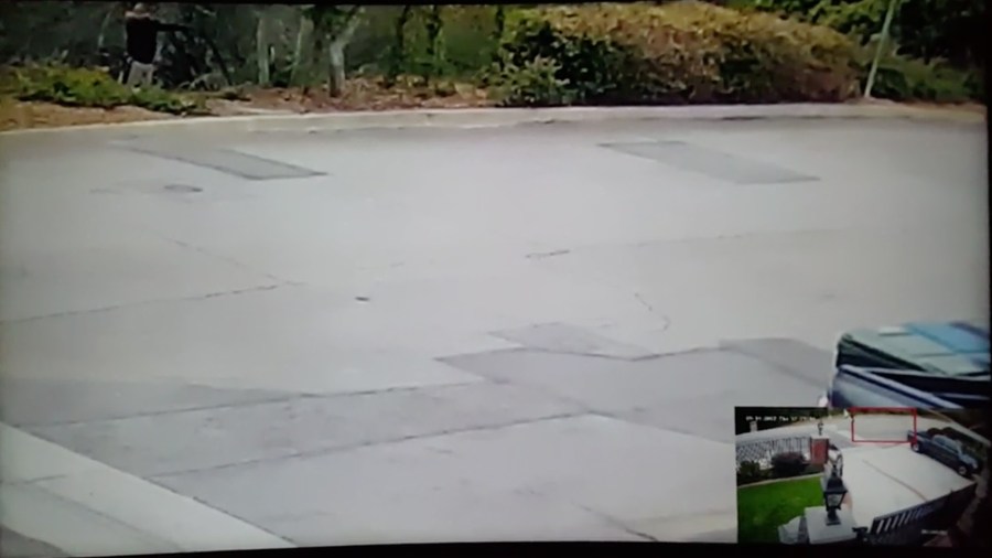 In the upper left corner, a hunter can be seen drawing a bow on Sept. 14, 2017, in a Monrovia home's surveillance video.