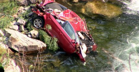 Officials executed a recovery operation on Sept. 1, 2017, to extract two bodies from a 2016 Hyundai Sonata that has been stuck against a rock since late July. (Credit: Fresno County Sheriff's Office Search and Rescue)