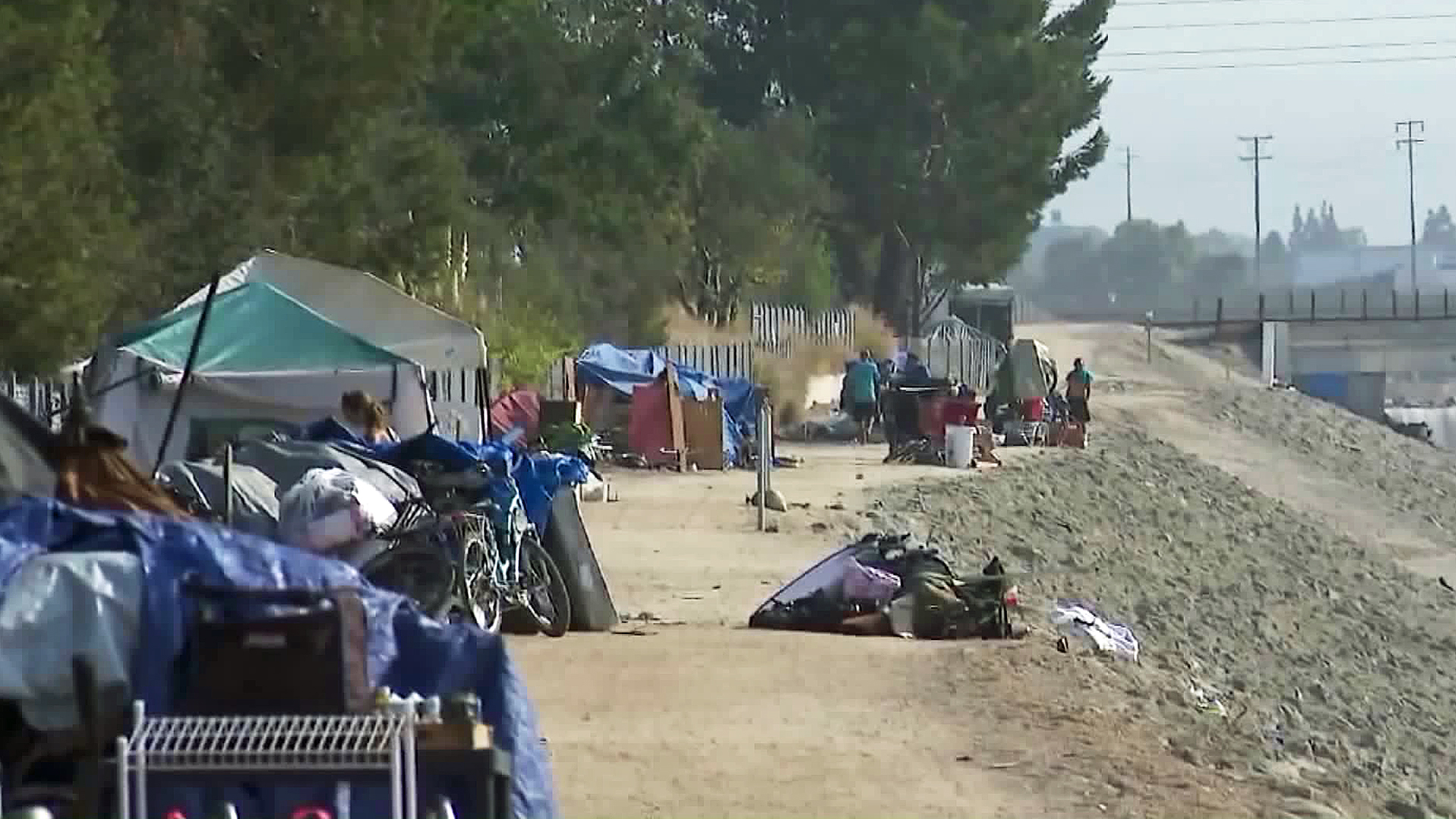 A homeless encampment along the Santa Ana River is seen on Sept. 12, 2017. (Credit: KTLA)