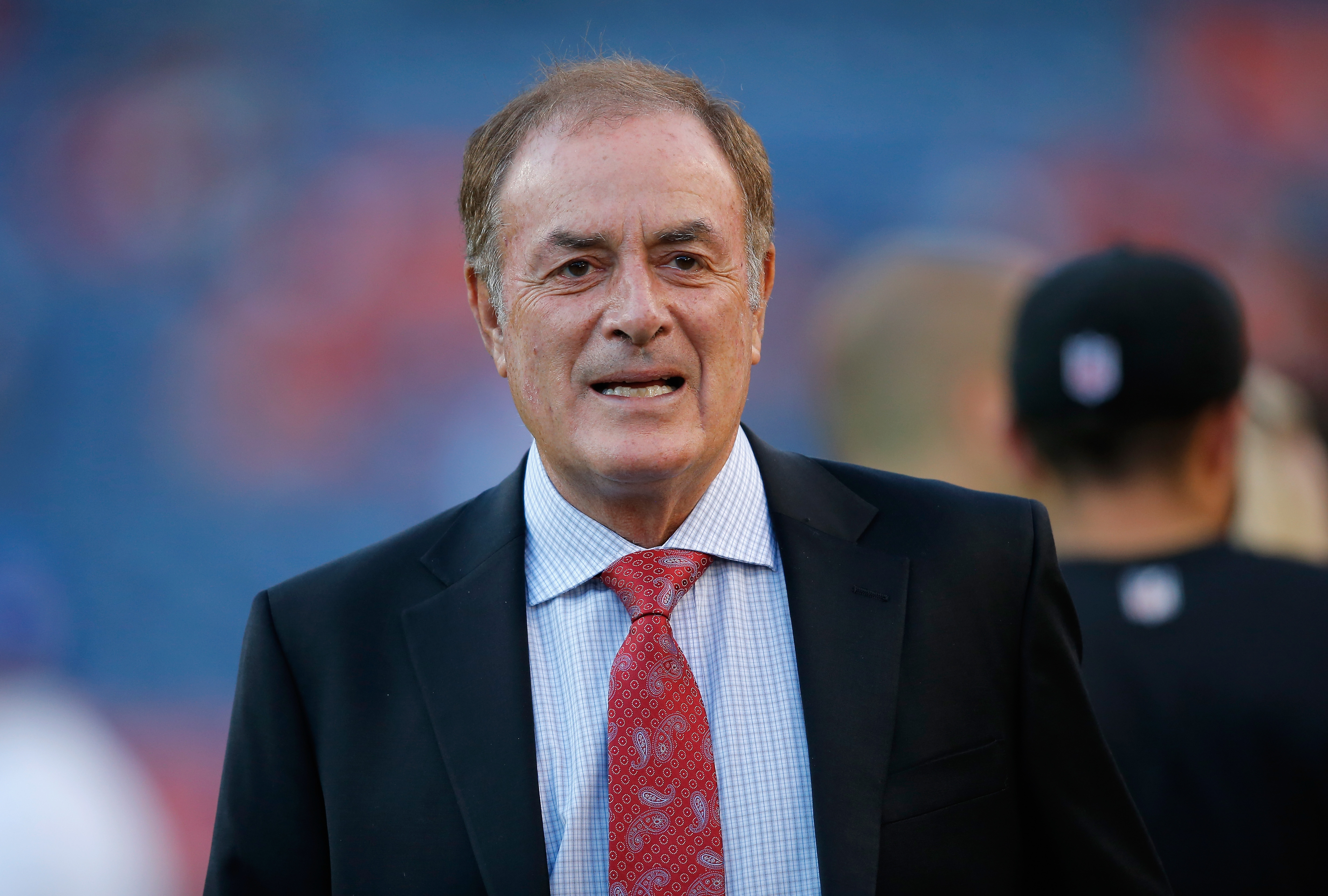 Al Michaels of NBC Sports works the game between the San Francisco 49ers and the Denver Broncos at Sports Authority Field at Mile High on October 19, 2014 in Denver, Colorado. (Credit: Doug Pensinger/Getty Images)