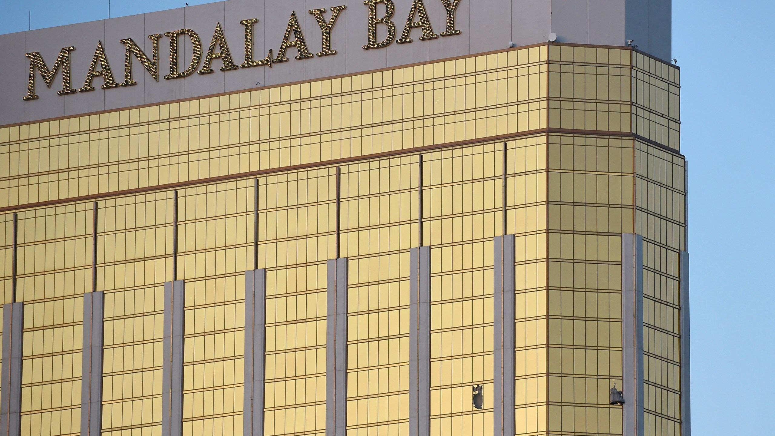 Broken windows are seen on the 32nd floor of the Mandalay Bay Resort and Casino after a lone gunman opened fired on the Route 91 Harvest country music festival on October 2, 2017 in Las Vegas, Nevada. (Credit: David Becker/Getty Images)