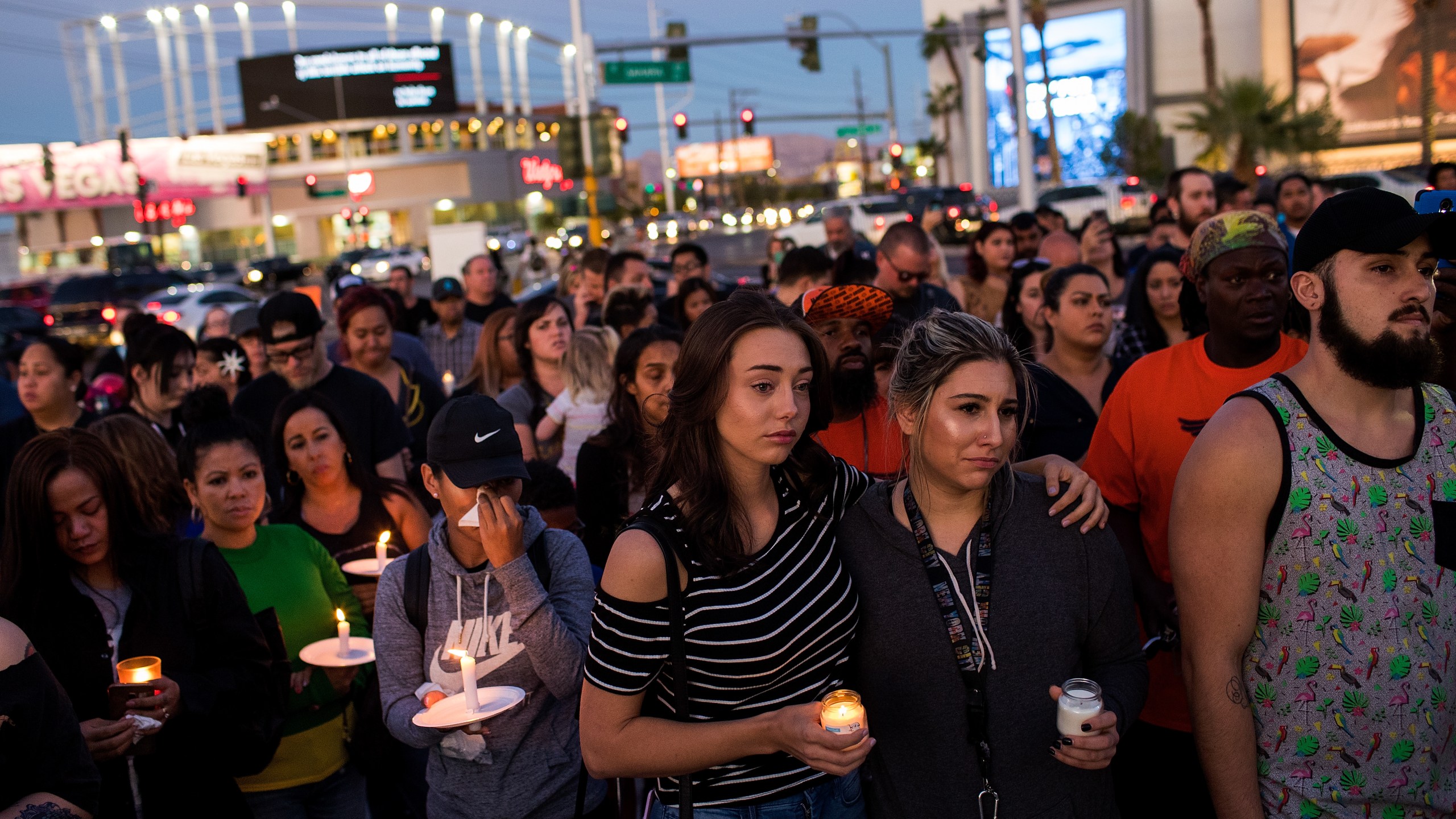 Mourners attend a candlelight vigil at the corner of Sahara Avenue and Las Vegas Boulevard for the victims of Sunday night's mass shooting, October 2, 2017 in Las Vegas, Nevada. (Credit: Drew Angerer/Getty Images)