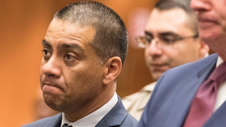 Los Angeles Unified school board member Ref Rodriguez, left, appears in court in September, 2017. (Credit: Brian van der Brug / Los Angeles Times)