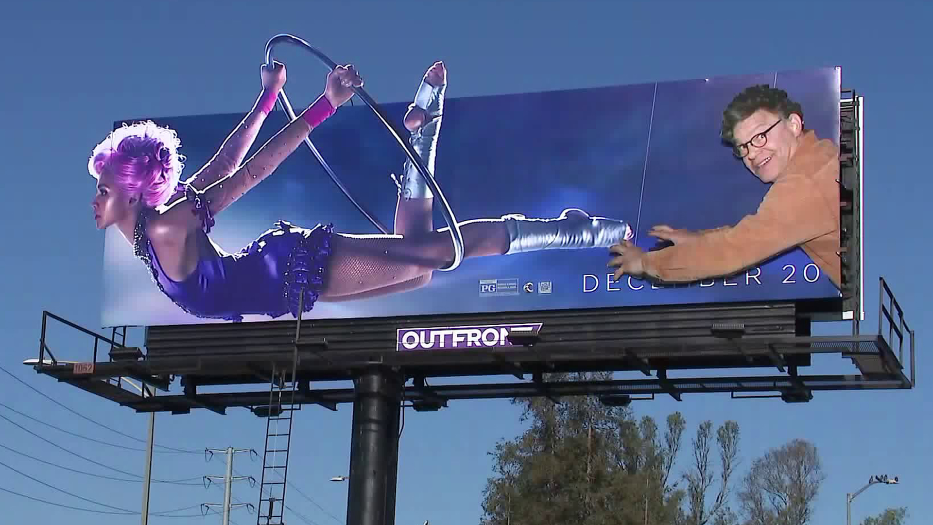 Street art collective UnsavoryAgents is behind the addition of Al Franken's likeness to a film billboard near the 10 Freeway in Palms. (Credit: KTLA)