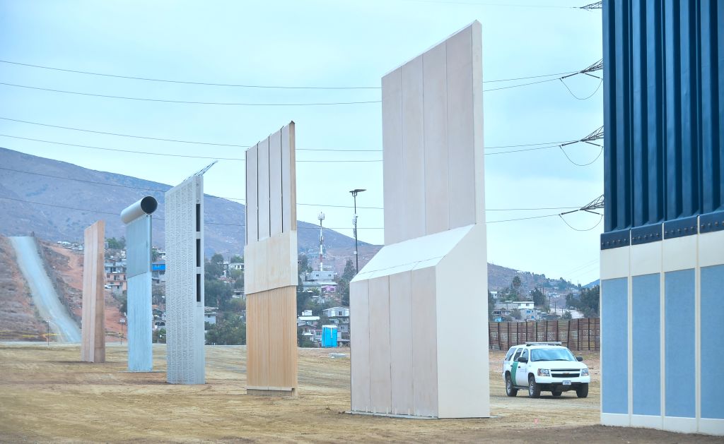 A U.S. Homeland Security border patrol agent drives past President Donald Trump's proposed border wall on November 1, 2017 in San Diego, California. (Credit: FREDERIC J. BROWN/AFP/Getty Images)