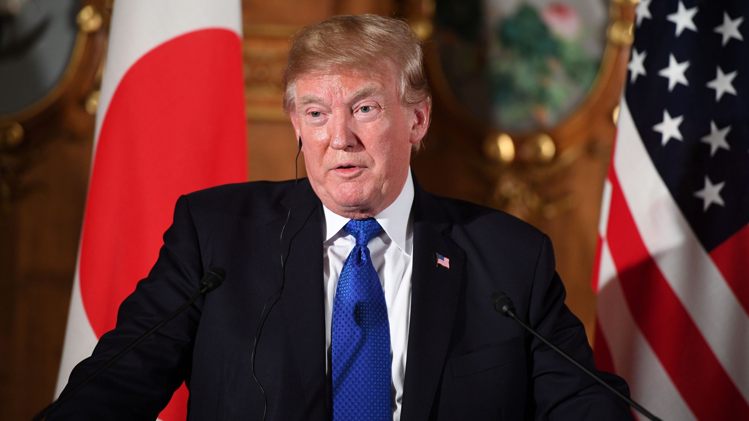 US President Donald Trump and Japanese Prime Minister Shinzo Abe (not pictured) attend a joint press conference at Akasaka Palace in Tokyo on November 6, 2017. (Credit: JIM WATSON/AFP/Getty Images)