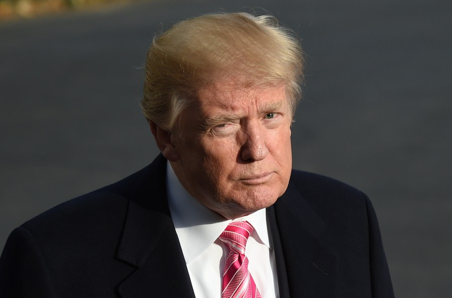 US President Donald Trump speaks to the press before departing from the south lawn of the White House in Washington, DC on November 21, 2017. (Credit: ANDREW CABALLERO-REYNOLDS/AFP/Getty Images)