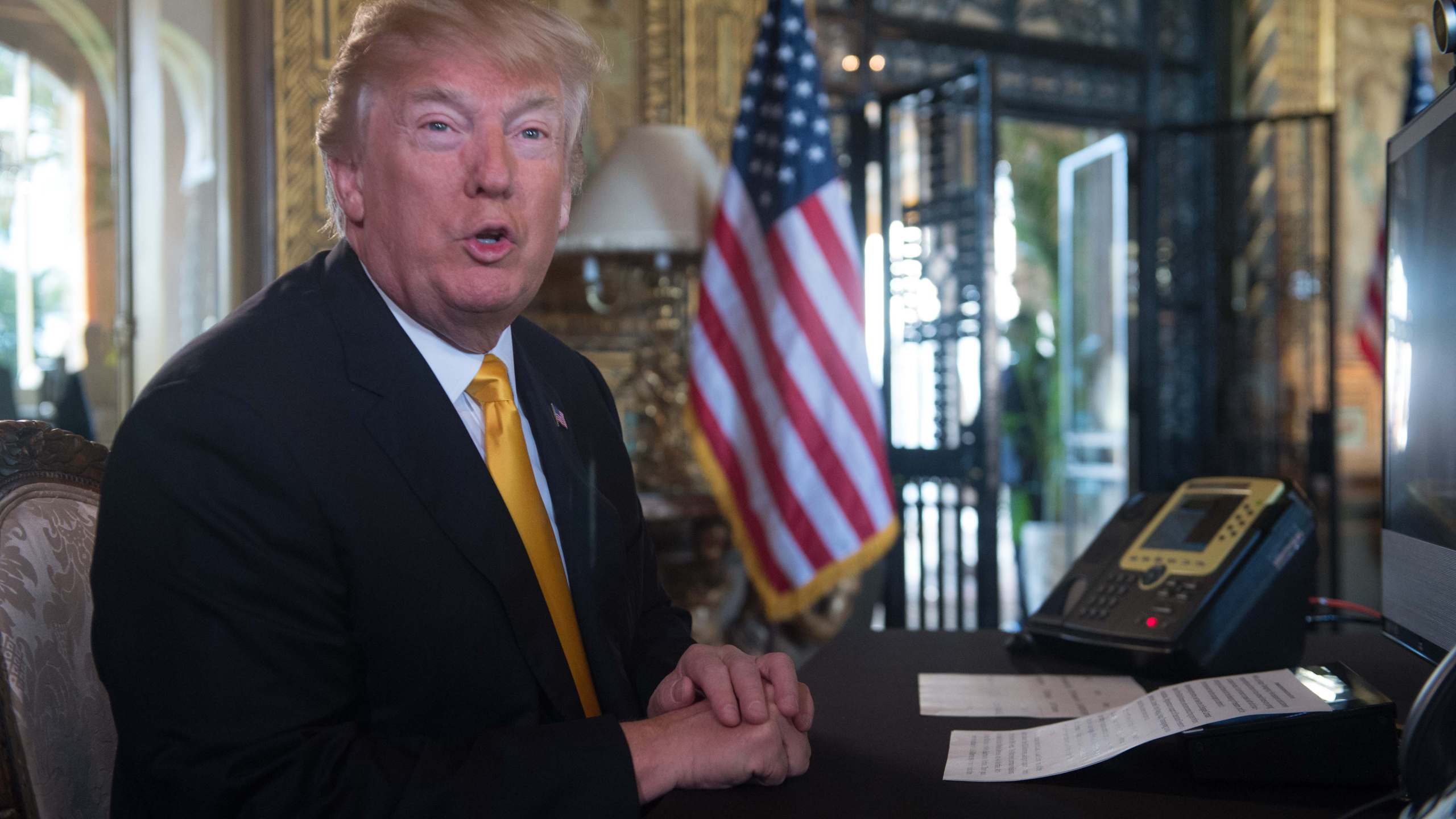 Donald Trump prepares his traditional address to thank members of the U.S. military via video teleconference from his residence in Mar-a-Lago in Florida on Thanksgiving Day, November 23, 2017. (Credit: Nicholas Kamm/AFP/Getty Images)