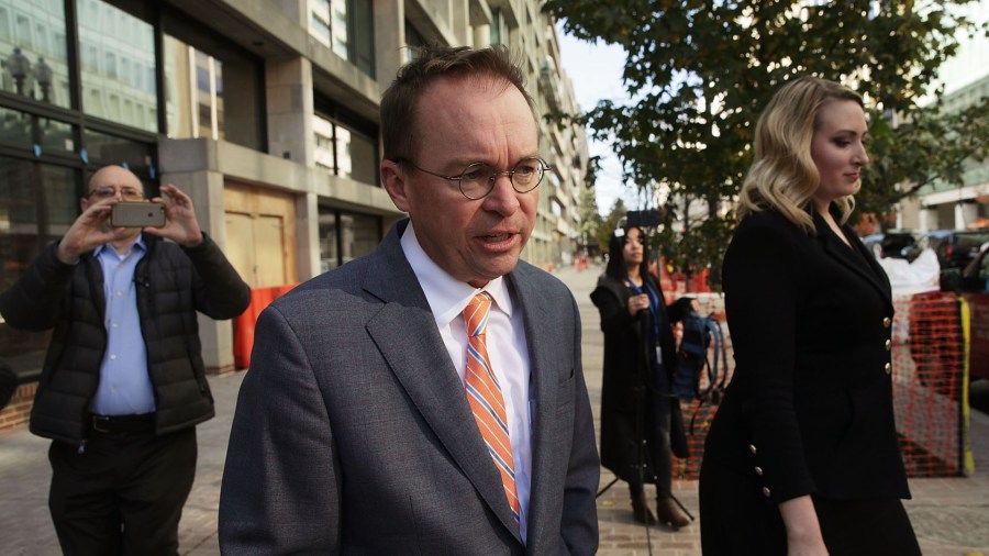 White House Budget Director Mick Mulvaney, President Trump's pick for acting director of the Consumer Financial Protection Bureau, walks back to the White House from the CFPB building after he showed up for his first day of work on November 27, 2017 in Washington, DC. (Credit: Alex Wong/Getty Images)